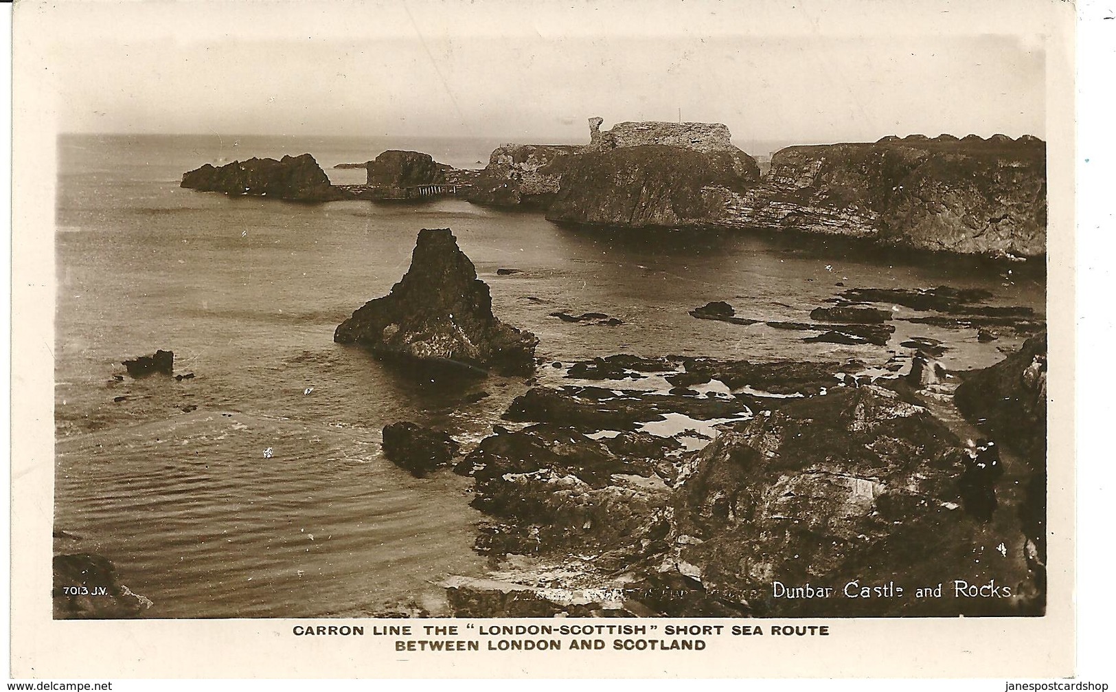 REAL PHOTOGRAPHIC POSTCARD DUMBAR CASTLE AND ROCKS - Advertising Carron Line - London-Scottish Sea Route - East Lothian