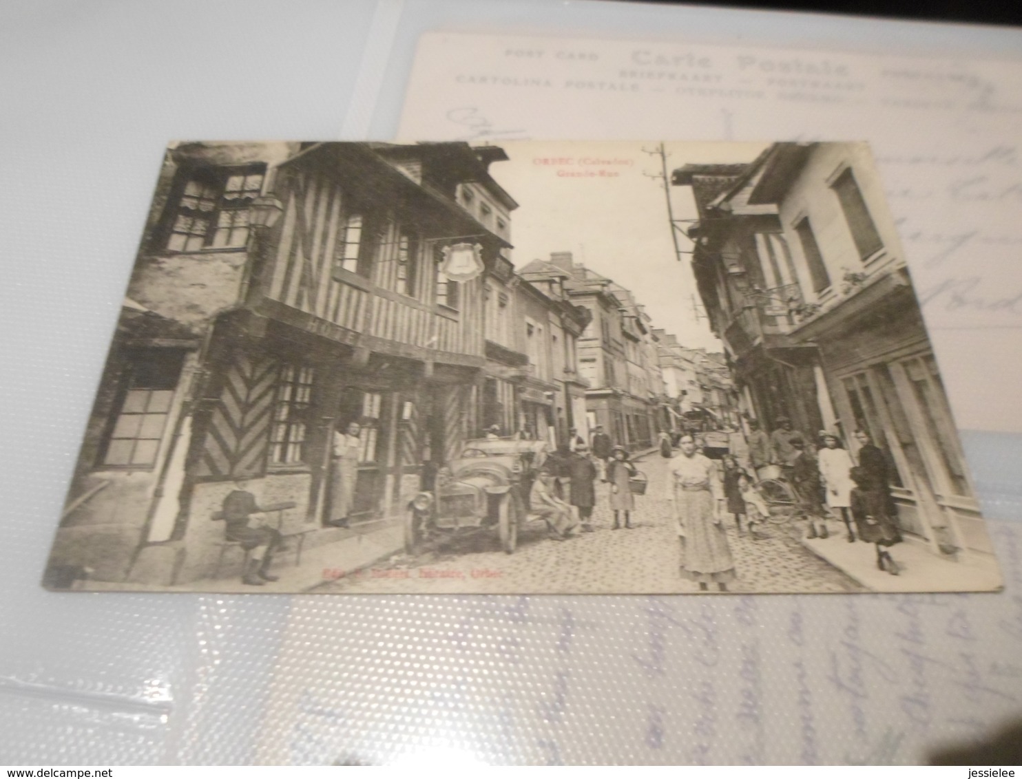 CPA ANIMEE - ORBEC - GRANDE RUE - COMMERCES - HOTEL - AUTOMOBILE - Marchands