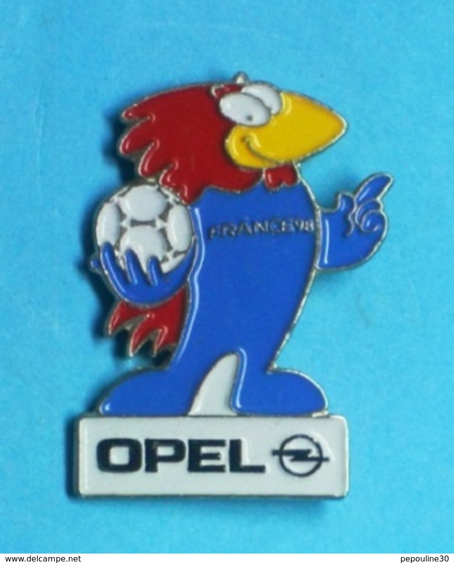 1 PIN'S //    ** FOOTIX / MASCOTTE DE FRANCE '98 / SPONSOR // OPEL ** . (© 1995 ISL™) - Opel