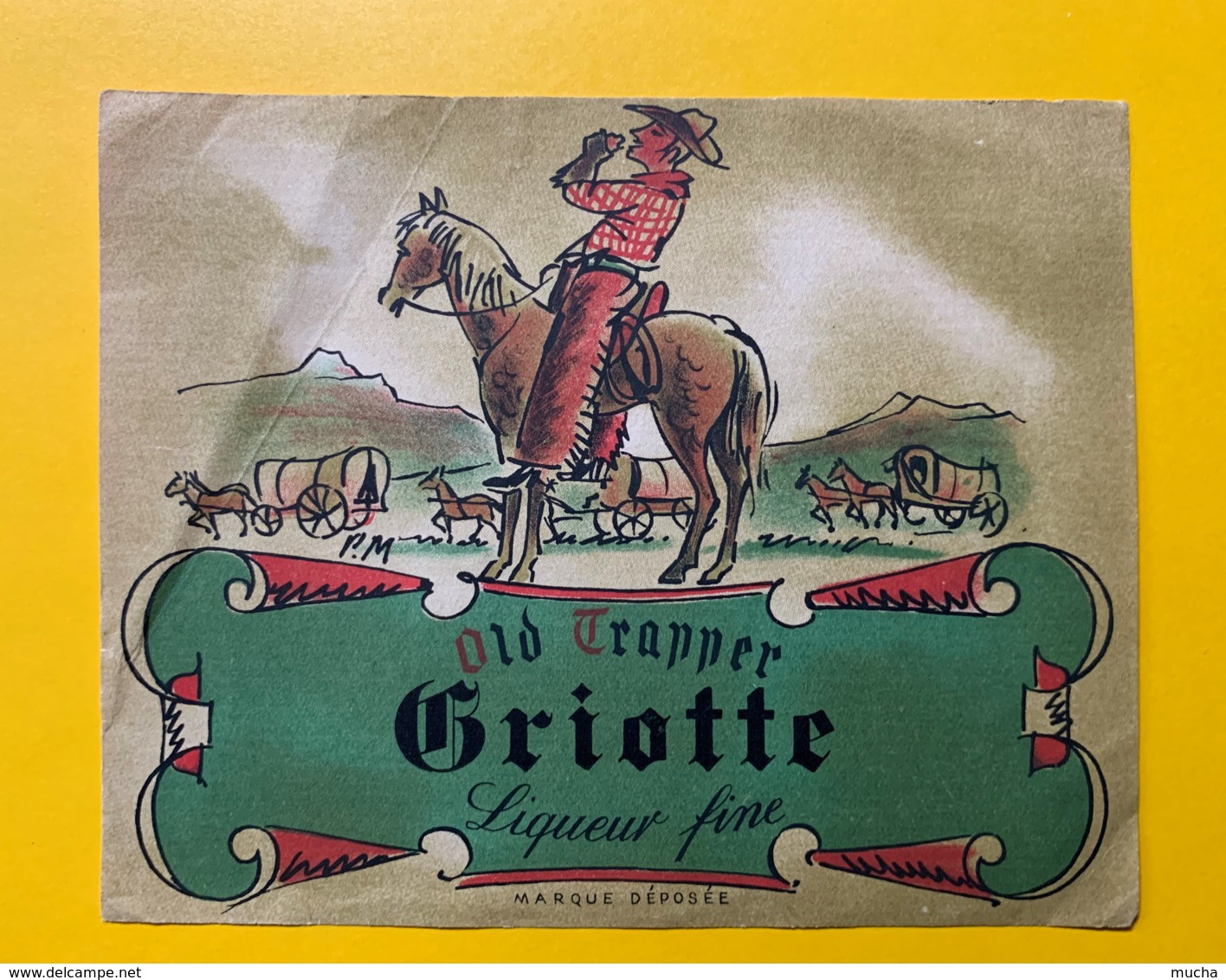 9734 - Old Trapper Liqueur De Griotte Pli Côté Gauche - Autres & Non Classés