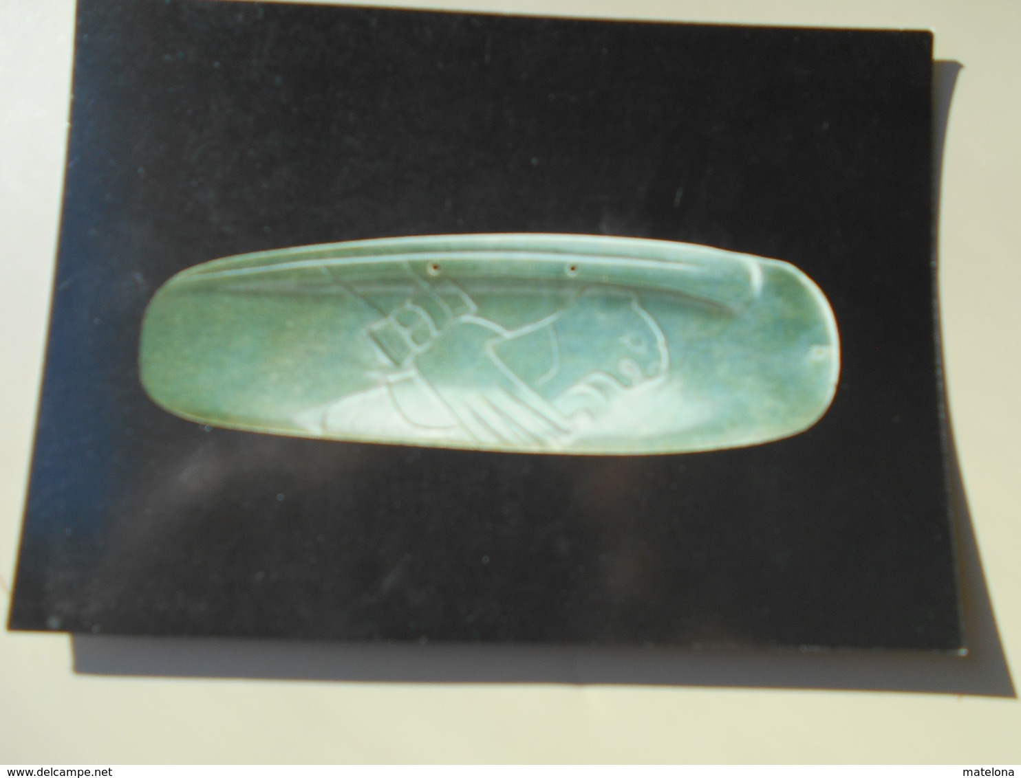 COSTA RICA NATIONAL MUSEUM OF COSTA RICA STYLISED JADE SEASHELL WITH HALF FELINE HALF INSECT HELD BY HUMAN HAND TIBAS - Costa Rica