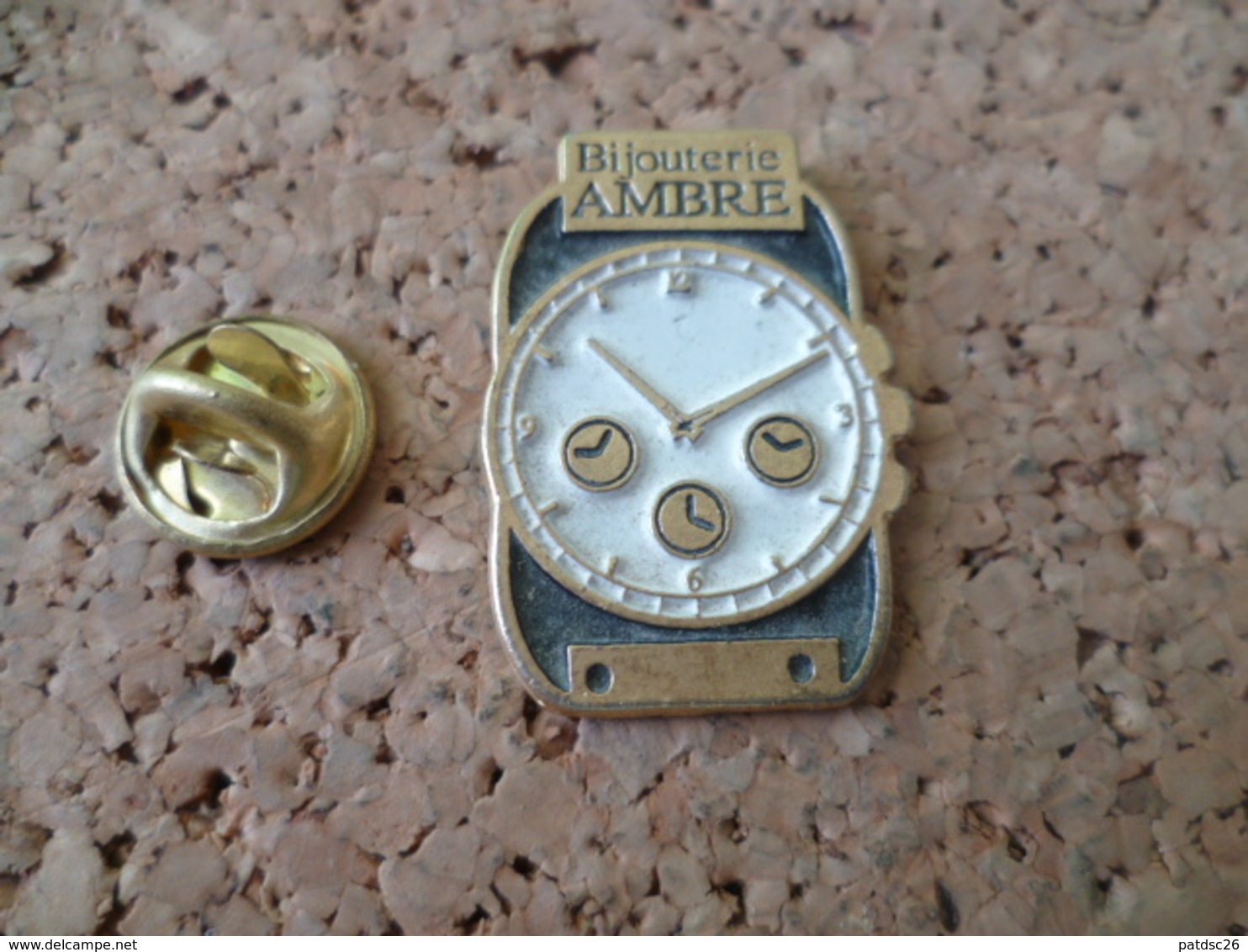 PIN'S    MONTRE   BIJOUTERIE  AMBRE - Autres & Non Classés