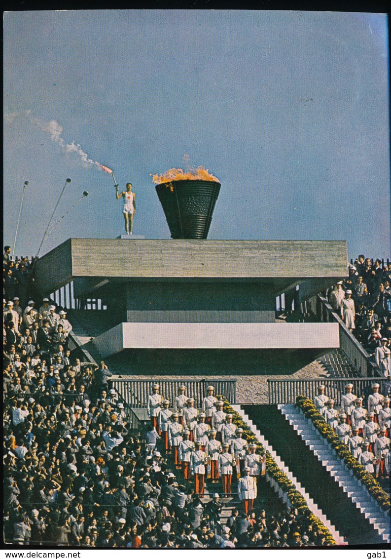 Tokyo -- Anchorman Yoshinori Sakai Aloft The Olympic Torch    --  1964 - Tokyo
