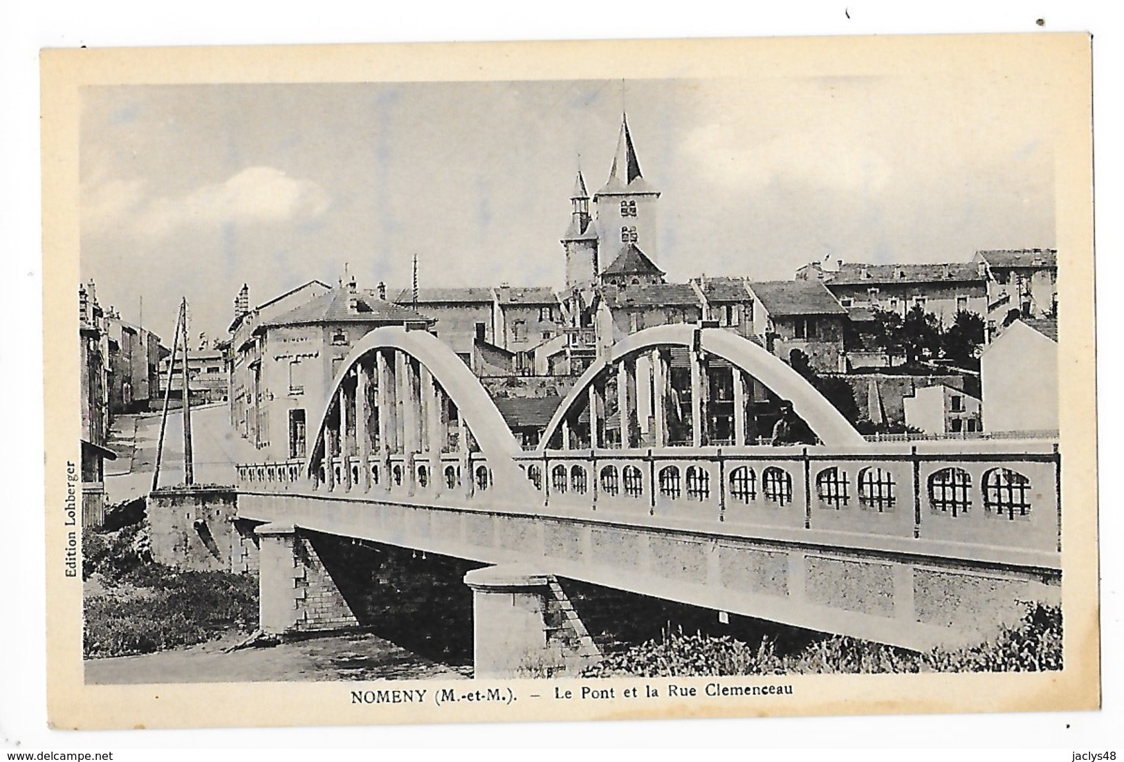 NOMENY  (cpa 75)  Le Pont Et La Rue Clémenceau   -  L 1 - Nomeny