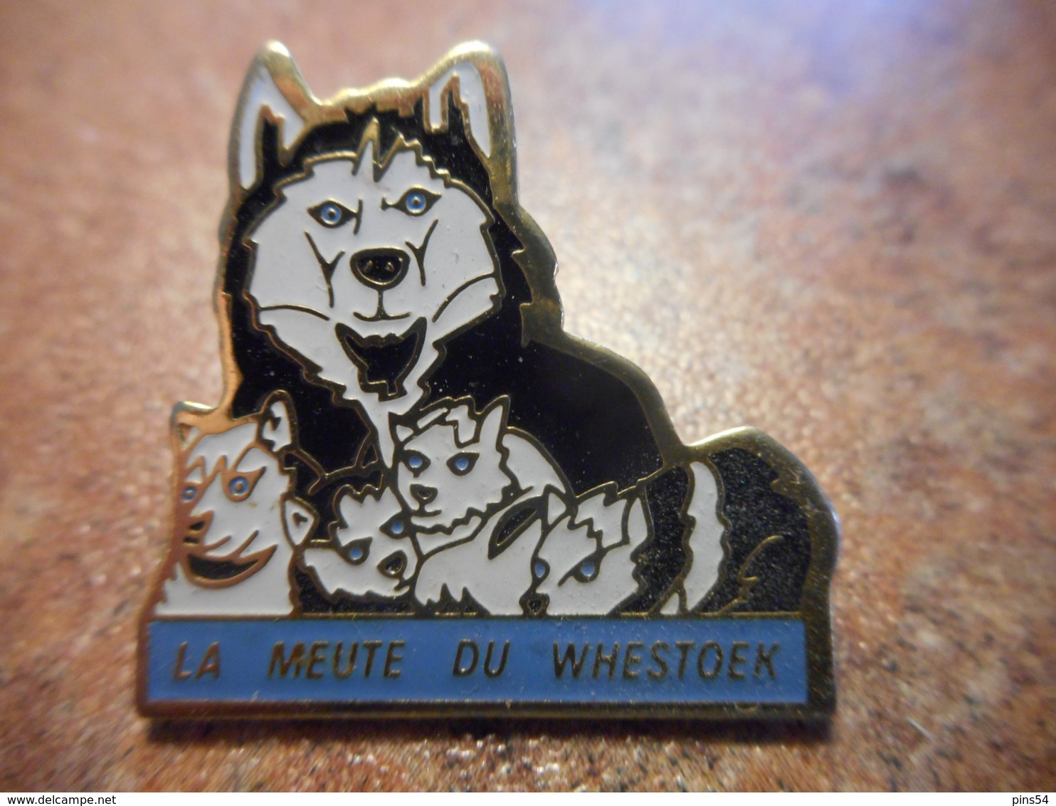 A027 -- Pin's La Meute Du Whestoek - Cities