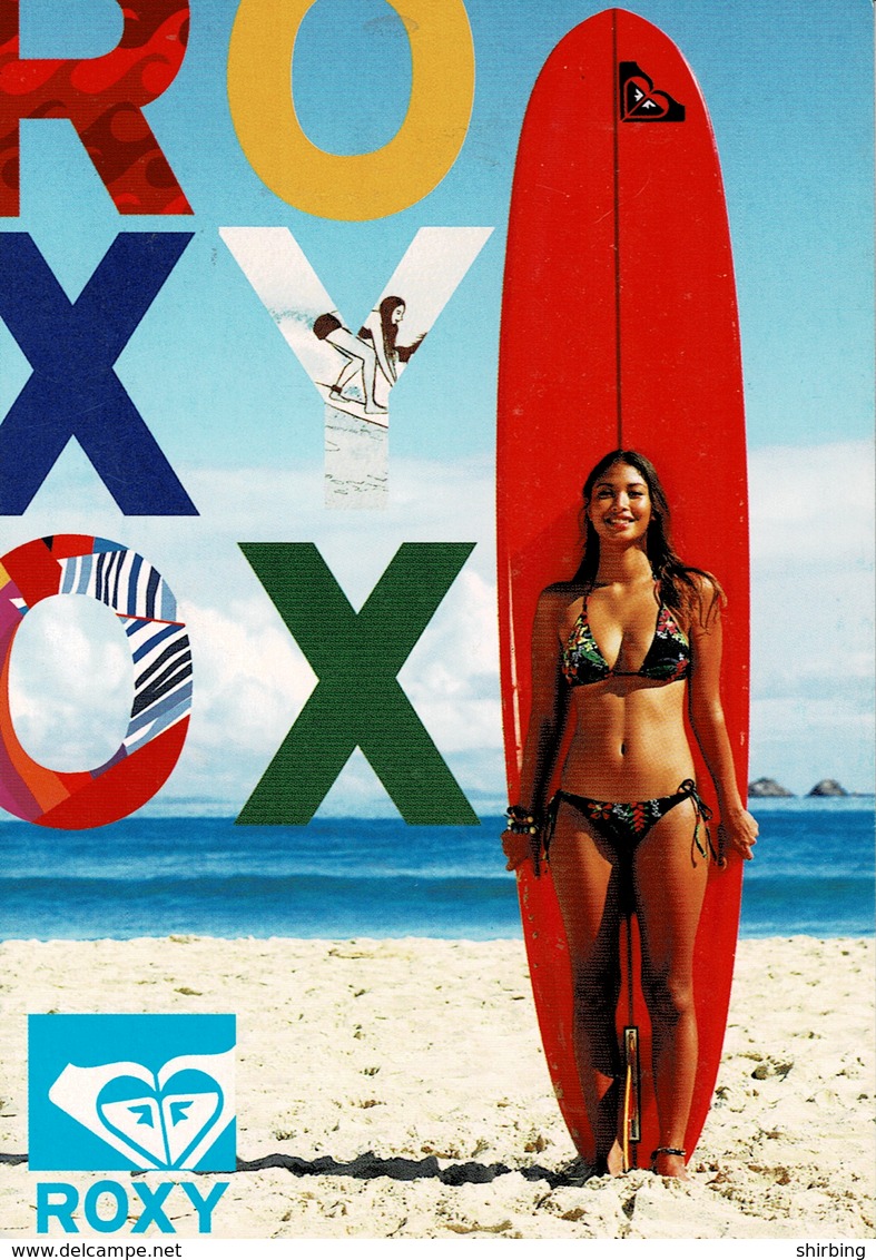 24J : Bikini Girl Standing In Front Of A Tall Surfing Board On Beach Advertisement Postcard - Other & Unclassified