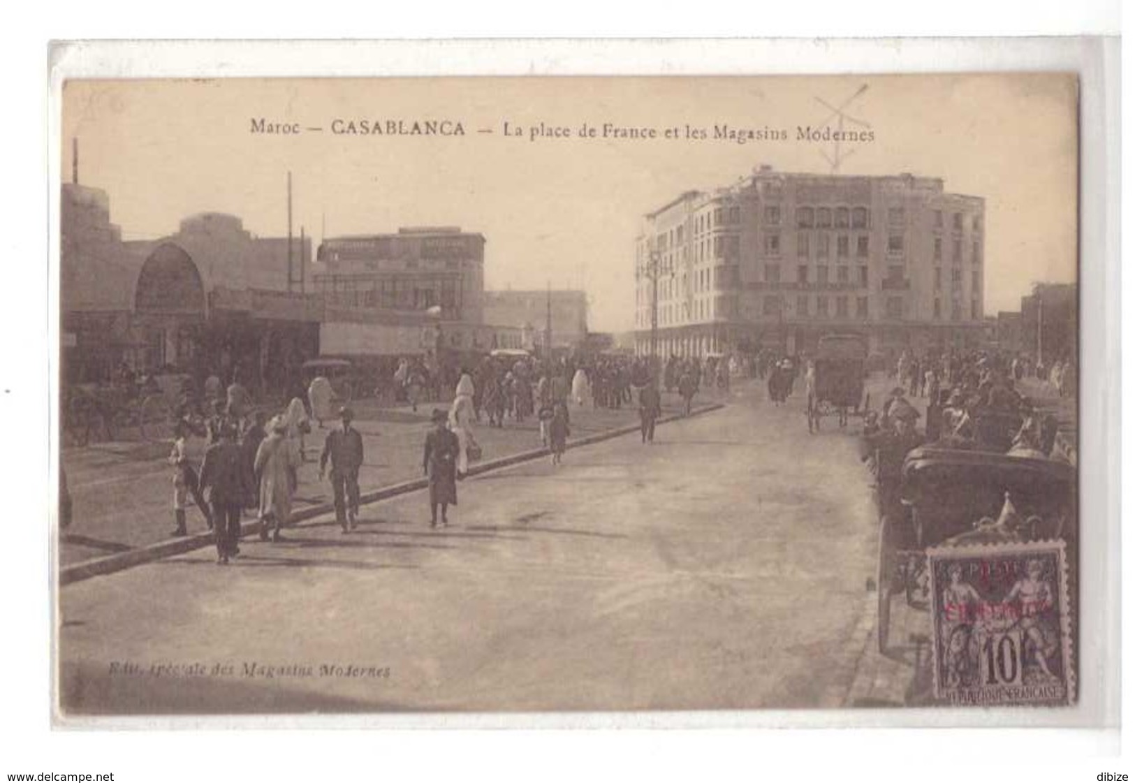 CPSM. Casablanca. La Place De France. Les Magasins Modernes. Animation. Timbre N° 3 De 1900. Dents En Moins. Circulé. - Casablanca