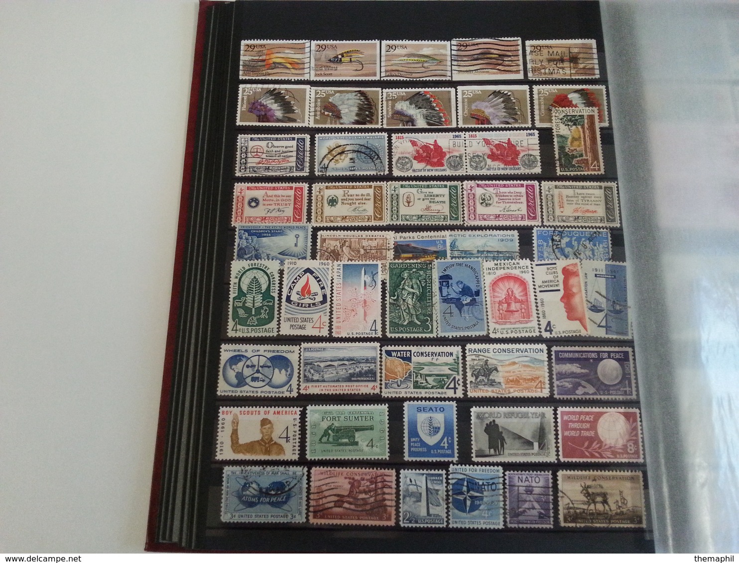 lot n° 524  ETATS UNIS  etc..  un bon classeur de timbres neufs  ou obl