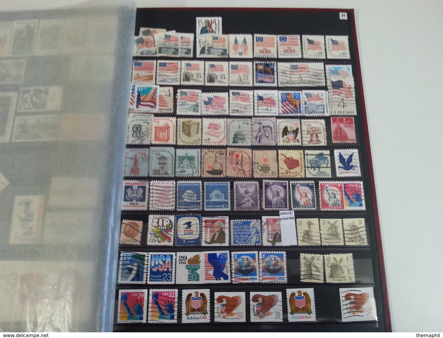 lot n° 524  ETATS UNIS  etc..  un bon classeur de timbres neufs  ou obl