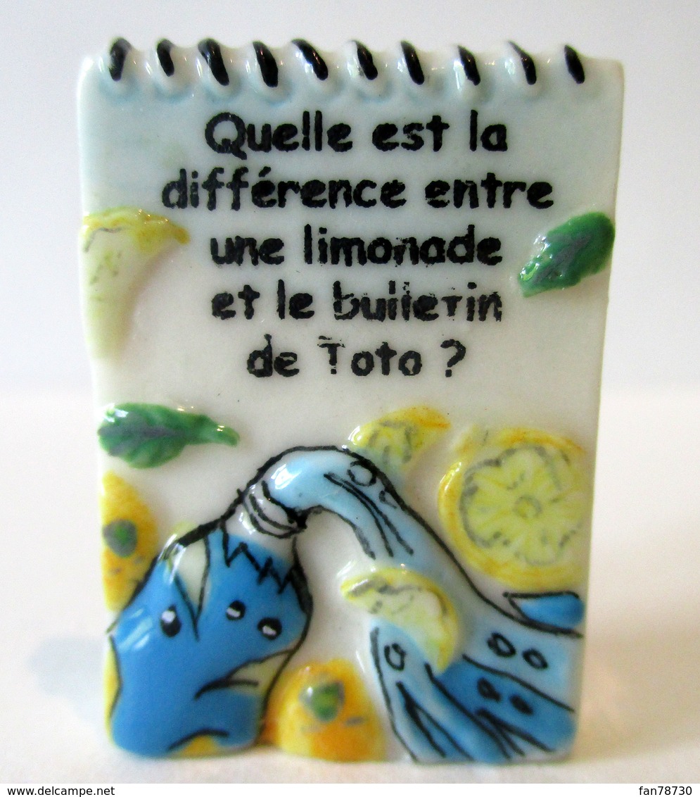 Fève Brillante Devinette  -  Quelle Est La Différence Entre Une Limonade Et Le Bulletin De Toto ? - Autres & Non Classés