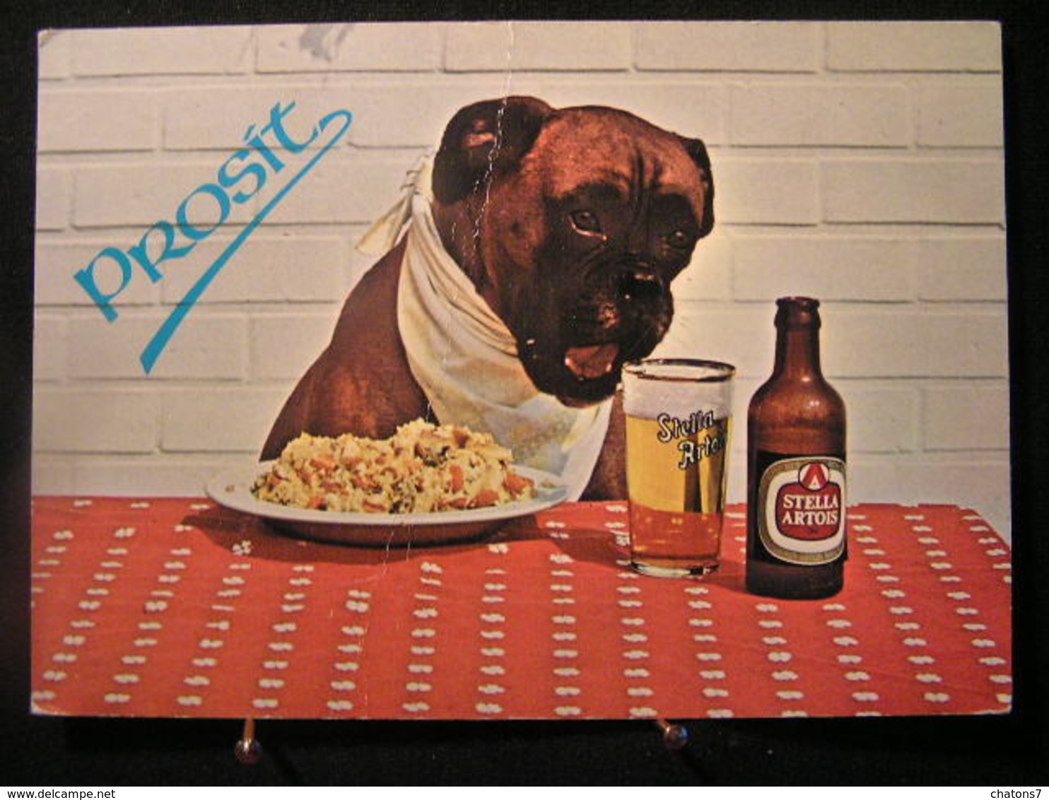 AN -211- Publicité - Bière Stella Artois Avec Un Gros Chien - Prosit - Légèrement Pliée En Diagonale - Circulé 1978 - Advertising