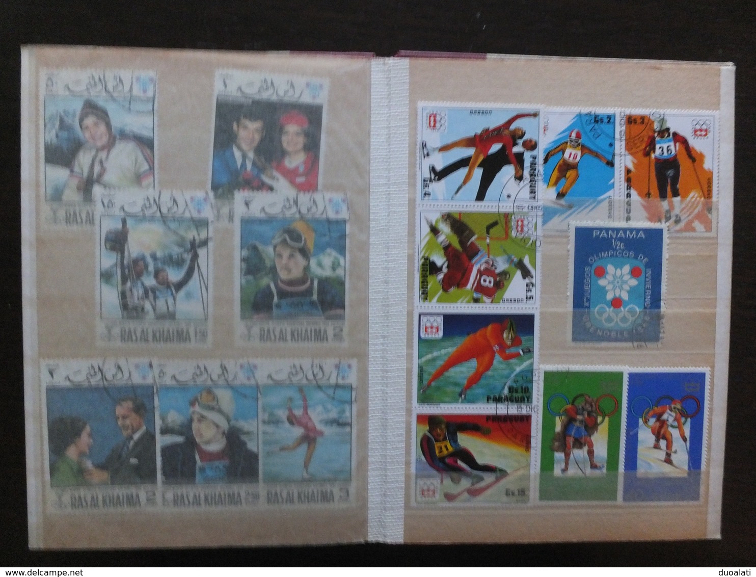 Huge collection of 155 used stamps on topic winter sport with album ski hockey ce skating, bob, speed skating, ski jump