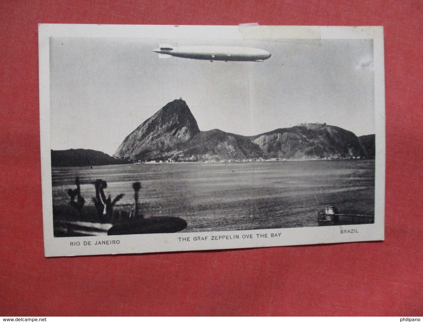 The Graf Zeppelin Over The Bay  Rio De Janeiro  Brazil -------Scotch Tape On Top Border   Ref    3554 - Dirigibili