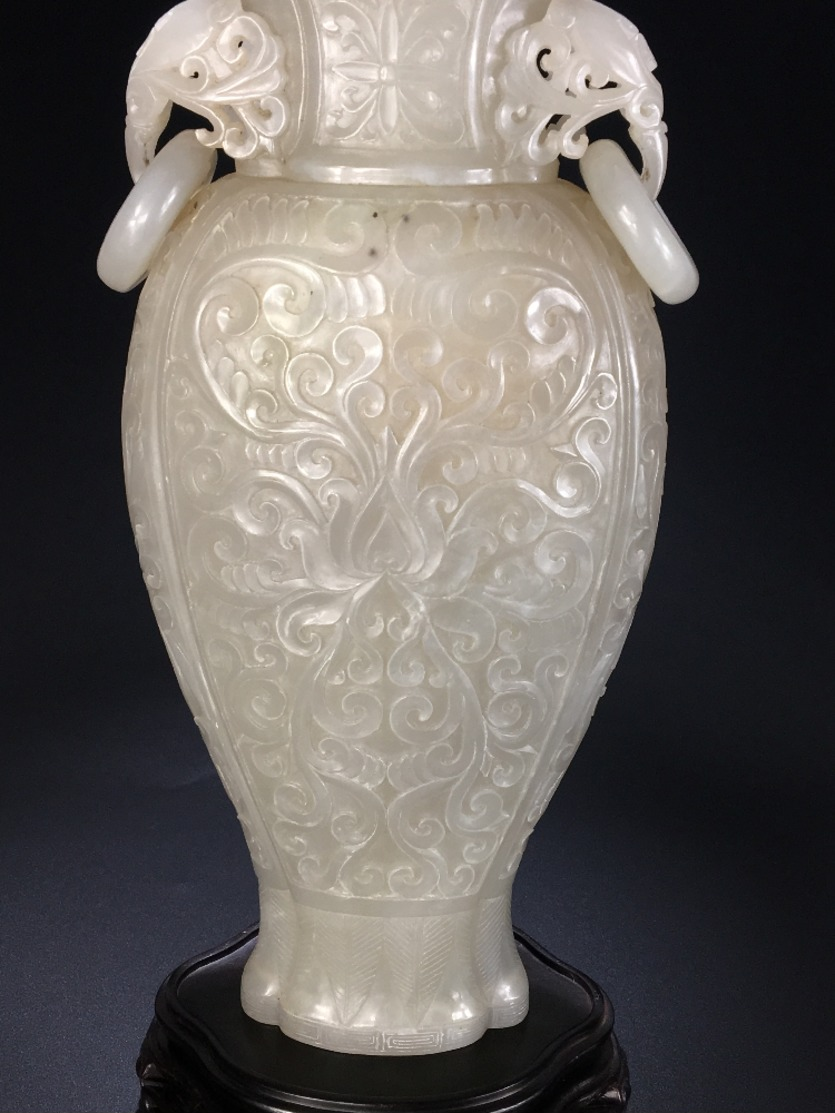 a very old jade vase sculpture from China