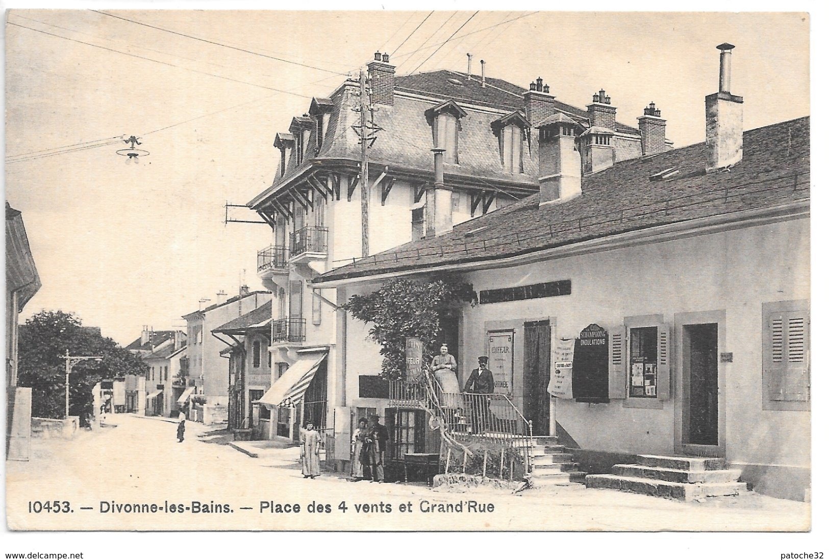 Cpa...Divonne-les-Bains...(ain)...place Des 4 Vents Et Grande Rue...animée...commerces...coiffeur...1912... - Divonne Les Bains