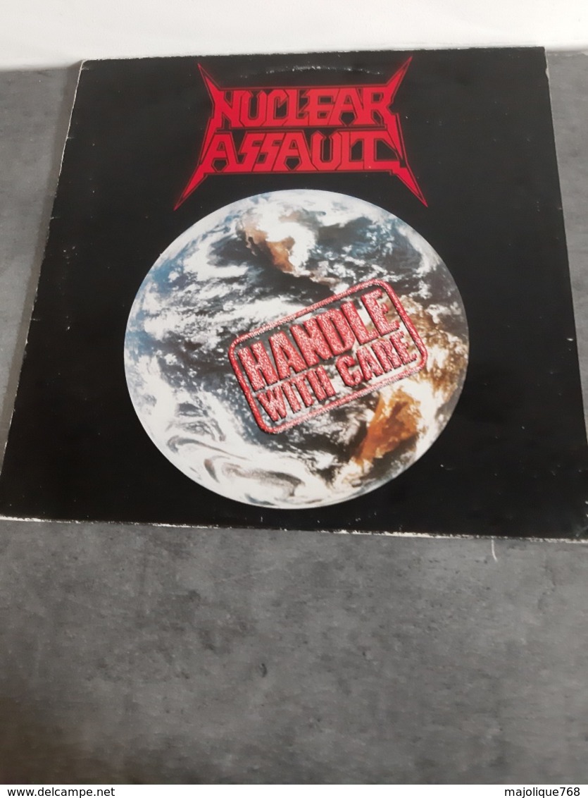 Nuclear Assault - Handle With Care - N.E.W. Musdisc 104621 - 1989 - Hard Rock & Metal