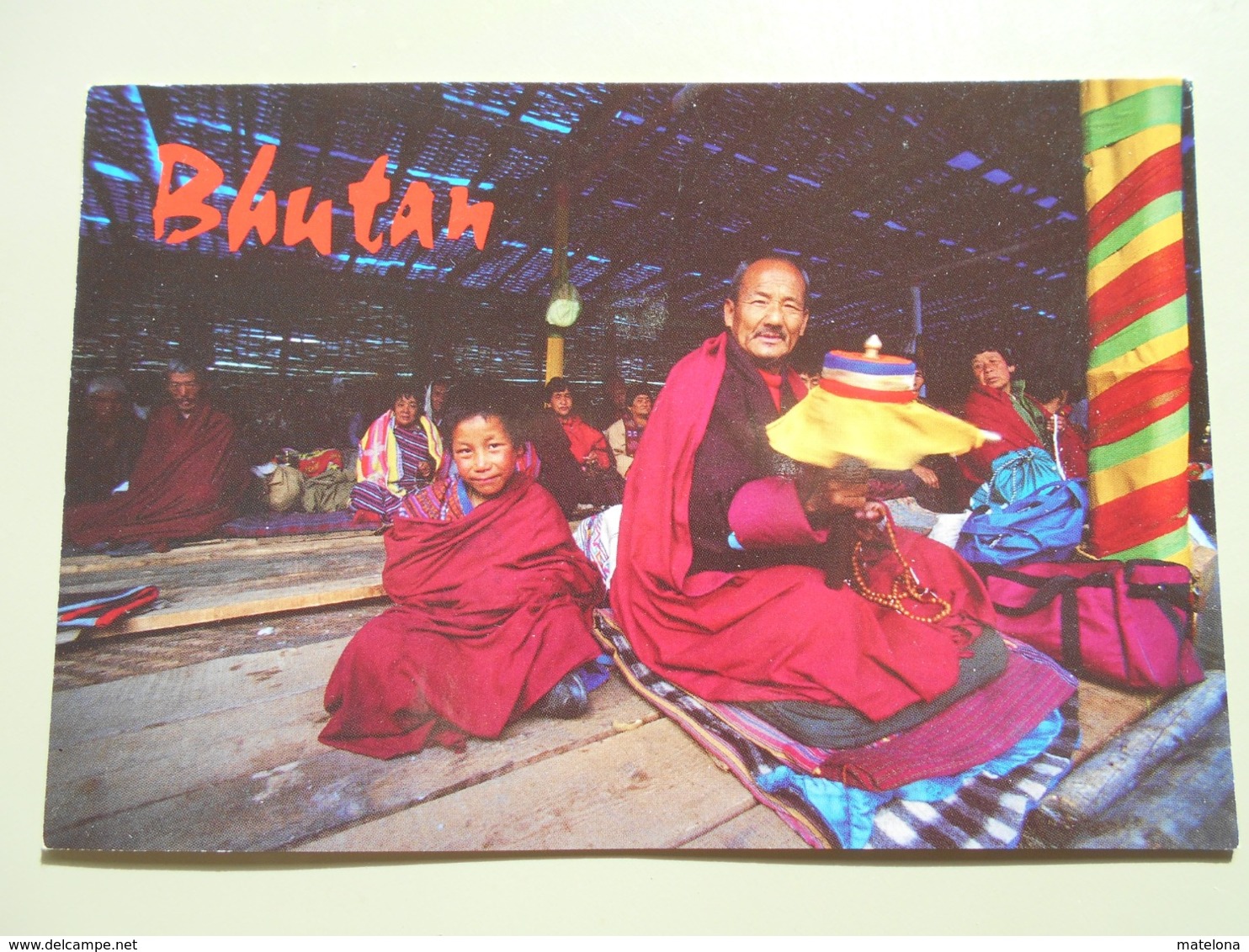 BHOUTAN OM MANI PADME HUM THIS PILGRIM CHANTS A BUDDHIST MANTRA WHILE SPINNING A PRAYER WHEEL... - Bhoutan