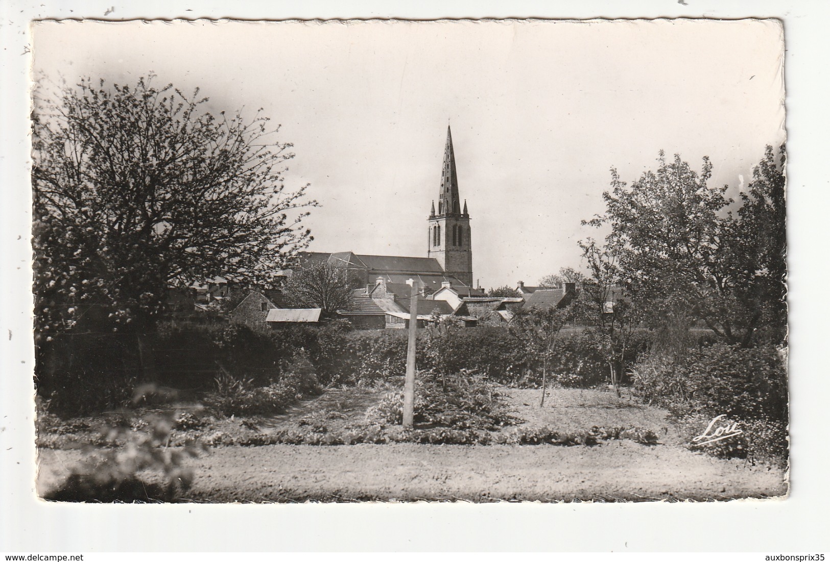 CPSM - PLOEZAL - CLOCHER ET EGLISE VUS DE LA GRAND ROUTE - 22 - Ploëzal