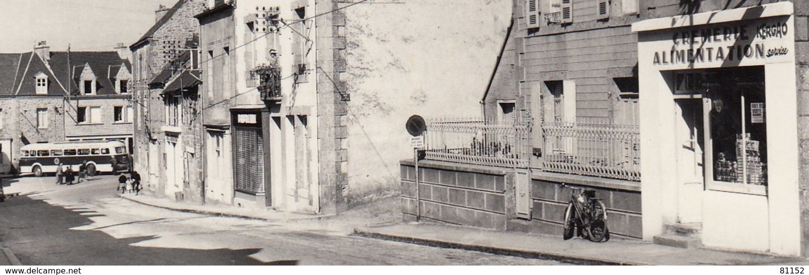 22   ROSTRENEN   C.du.N.  " Rue Olivier Perrin "  CPSM   Non  écrite  Avec  Magasin Alimentation Et AUTOBUS Au Fond - Autres & Non Classés