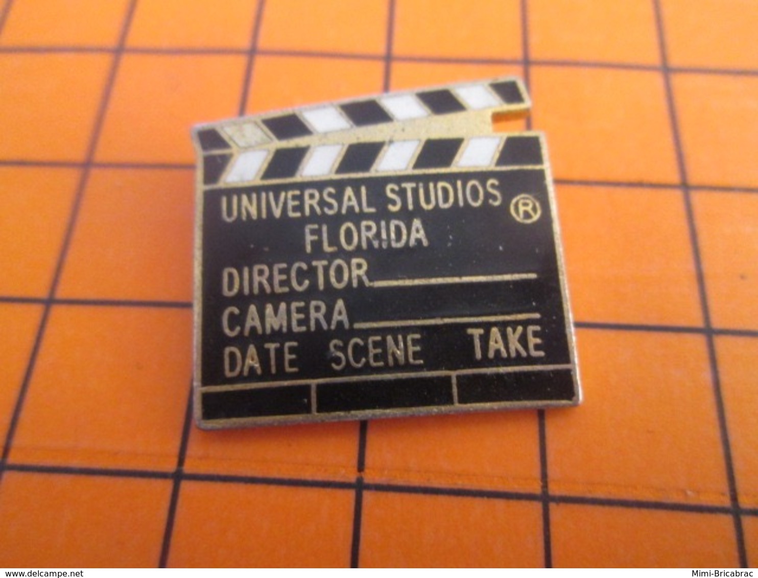 1319 Pin's Pins : BEAU ET RARE : Thème CINEMA / CLAP DE CINEMA UNIVERSAL STUDIO FLORIDA - Cinema