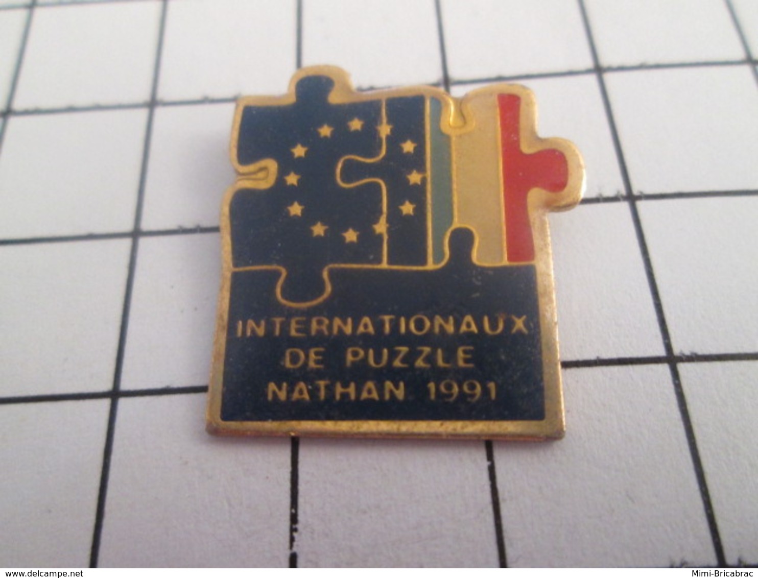 719 (pas 717)  PINS PIN'S / Beau Et Rare : Thème JEUX / INTERNATIONAUX DE PUZZLE NATHAN 1991 - Jeux