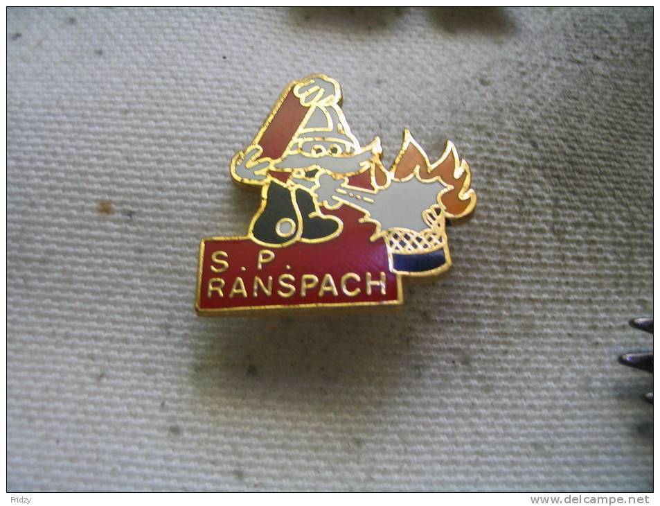 Pin's Des Sapeurs Pompiers De La Ville De RANSPACH (Pompier Avec Moustaches Blanches) - Brandweerman