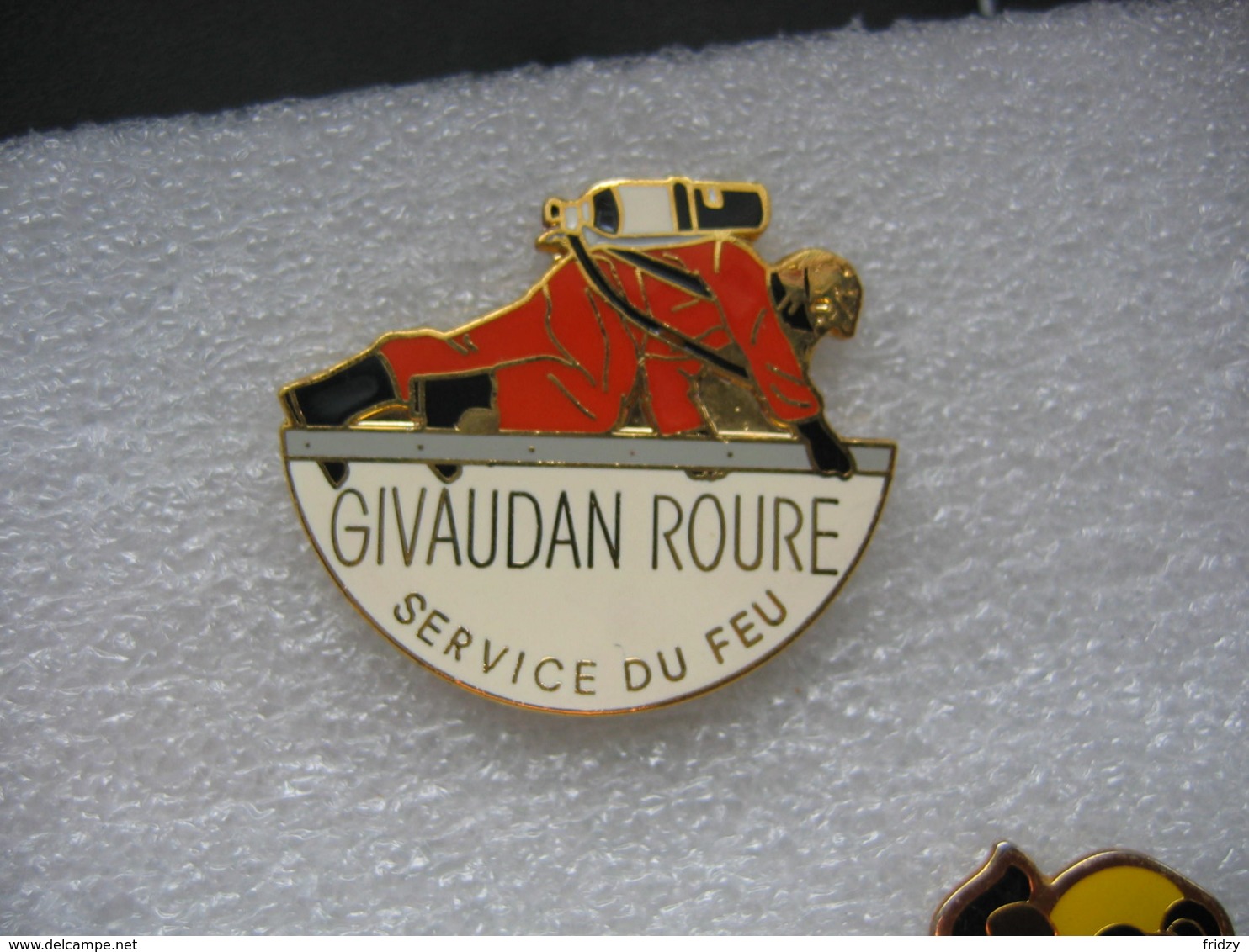 Pin's GIVAUDAN ROURE, Service Du Feu - Pompiers