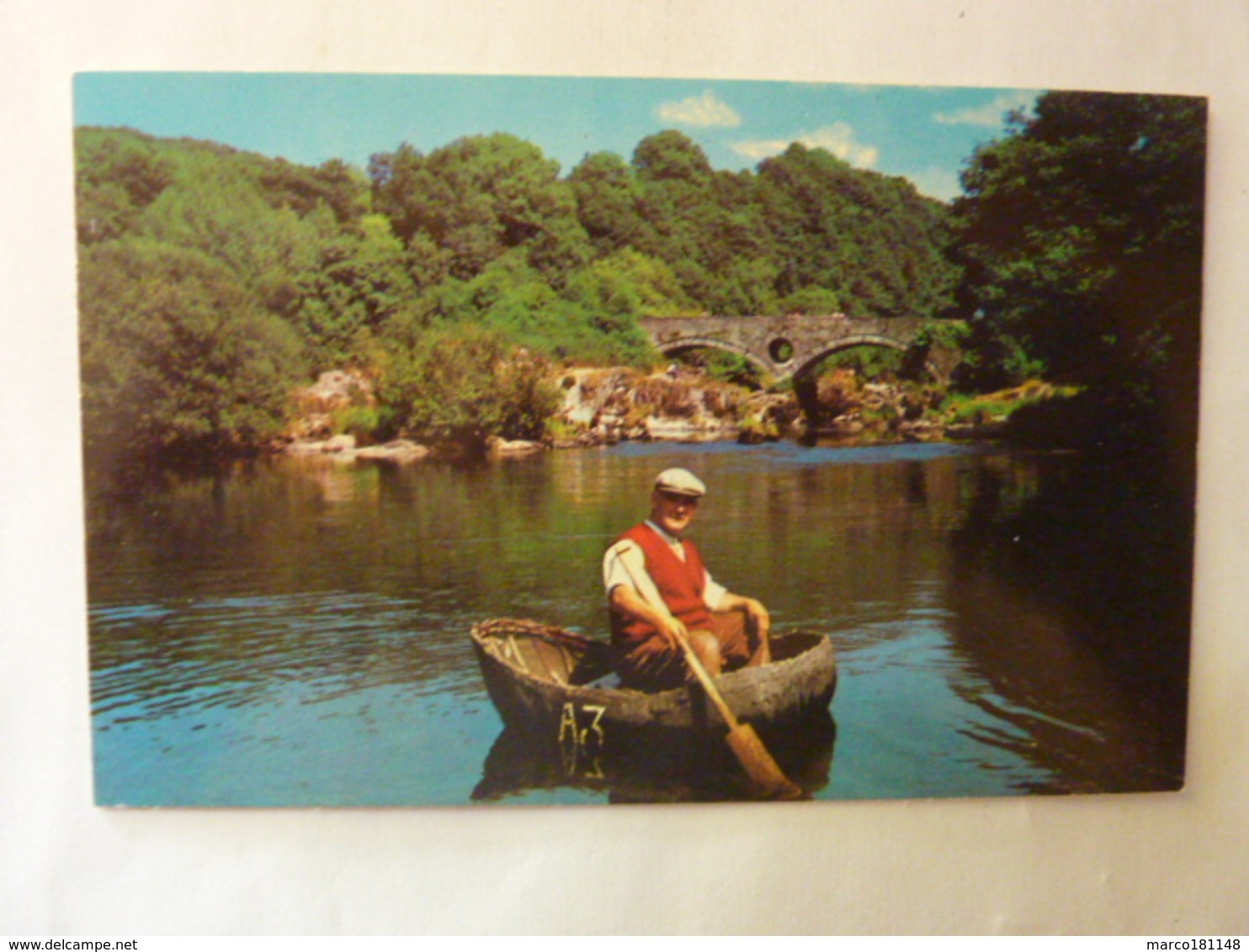 A CORACLE FISHERMANN AT CENARTH - Carmarthenshire