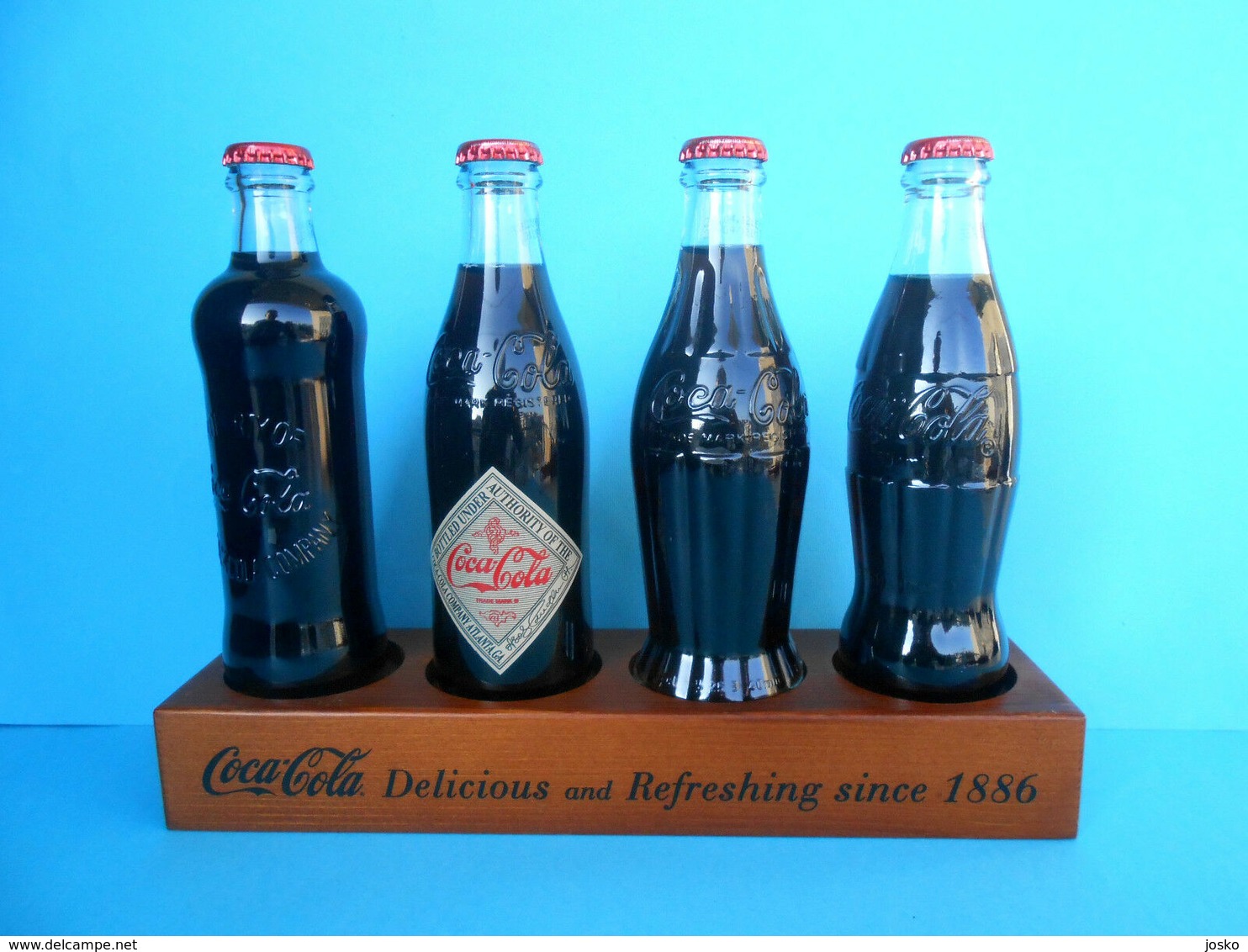 CROATIAN ISSUE ... COCA-COLA 125. YEARS - Full Set Of 4. Glass Bottles * FULL UNOPENED BOTTLES ON A SPECIAL RACK - Bouteilles