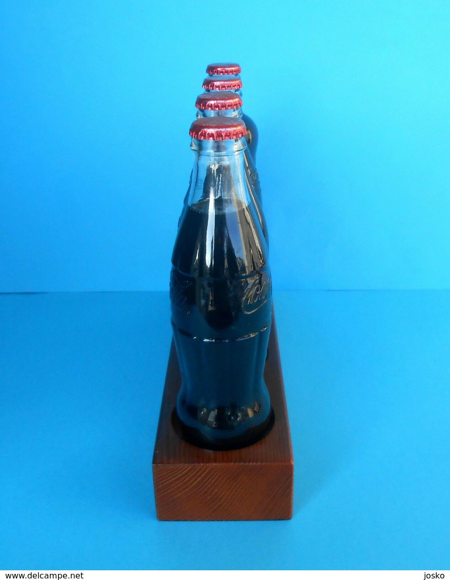 CROATIAN ISSUE ... COCA-COLA 125. YEARS - Full Set Of 4. Glass Bottles * FULL UNOPENED BOTTLES ON A SPECIAL RACK - Bottles