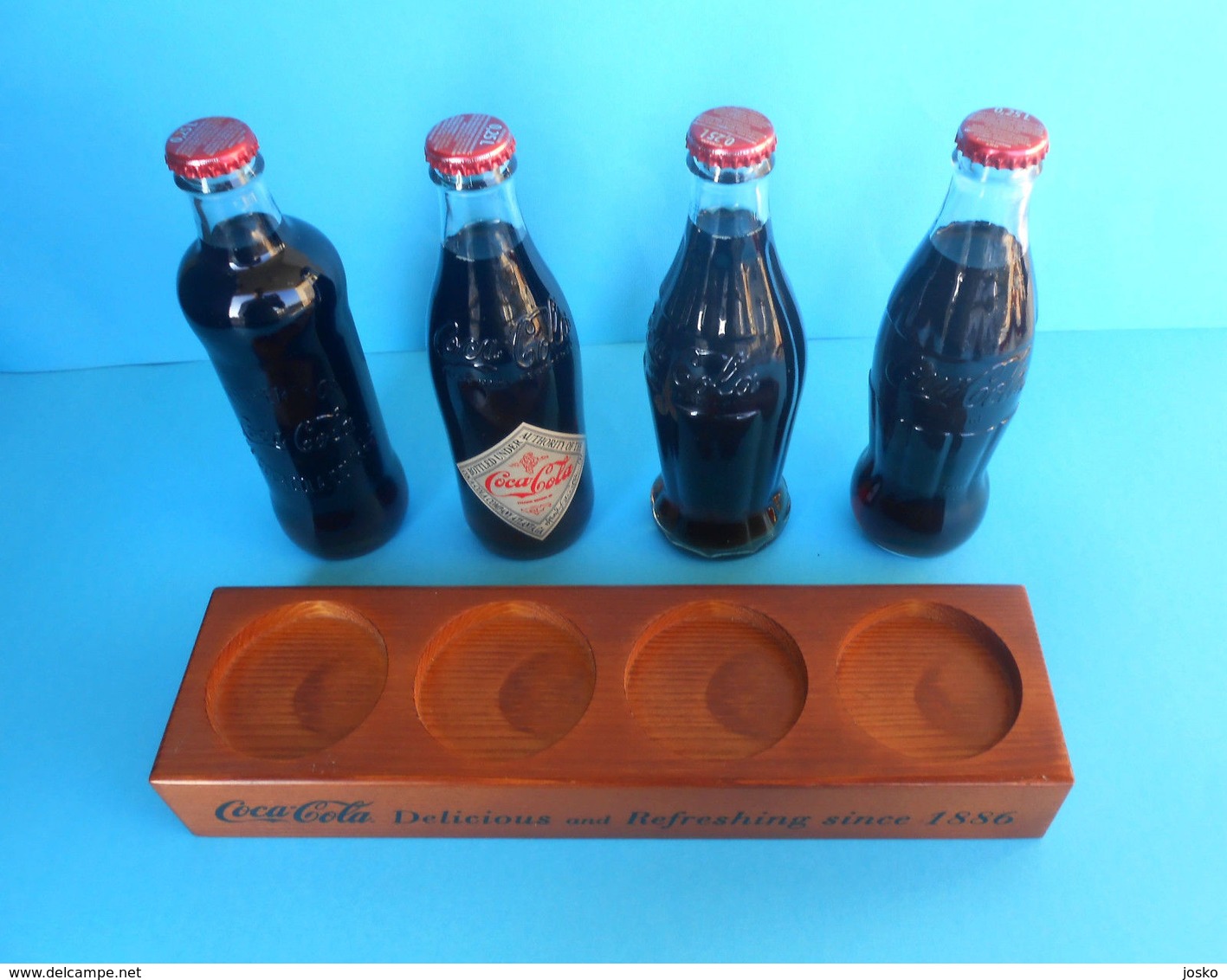 CROATIAN ISSUE ... COCA-COLA 125. YEARS - full set of 4. glass bottles * FULL UNOPENED BOTTLES ON A SPECIAL RACK