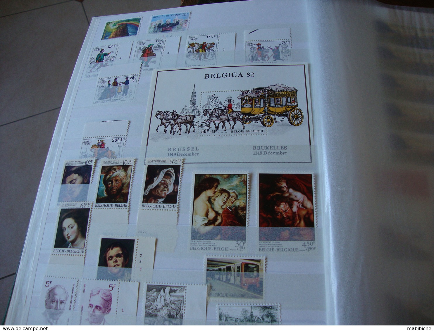 1 gros album de stock de timbres belges