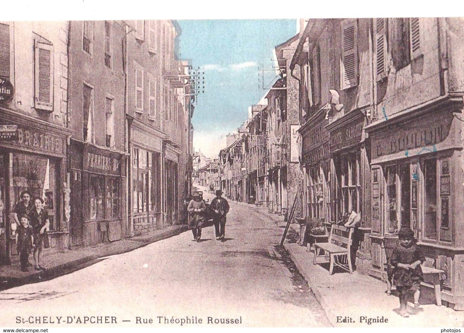 CPA : Saint Chély D'Apcher (48) Rue Théophile Roussel   Rare  Boutiques Boulangerie Librairie ... Animation Ed Pignide - Saint Chely D'Apcher