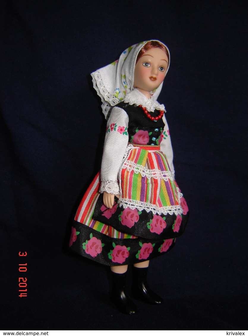 Porcelain doll in cloth dress -Poland   Republic -