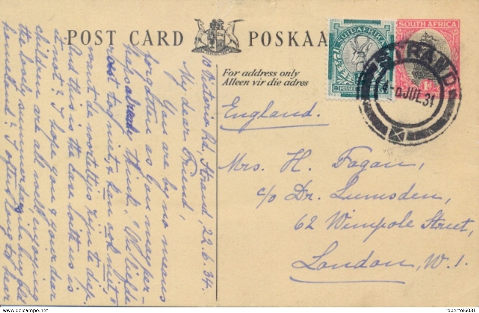 South Africa 1934 Postal Stationery Postcard 1 D. + ½ D. Springbok From Strand To Great Britain - Storia Postale