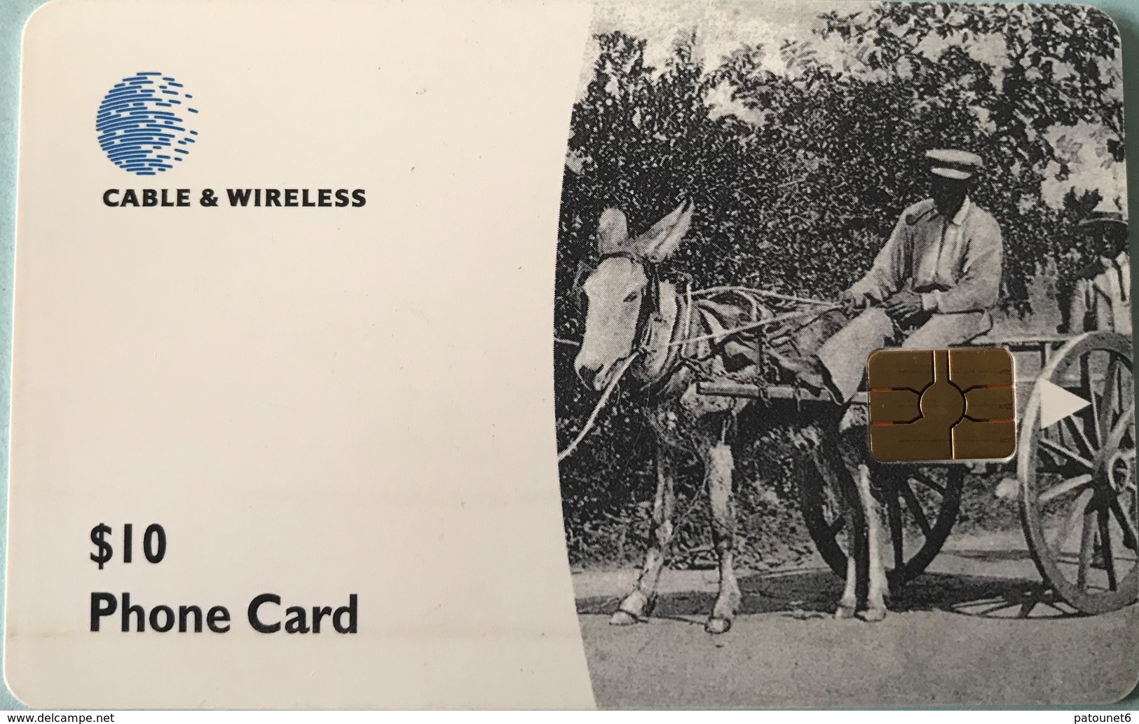 DOMINIQUE  -  Phonecard  -  Cable § Wireless  - A Man Riding A Donkey Cart  -  $ 10 - Dominica