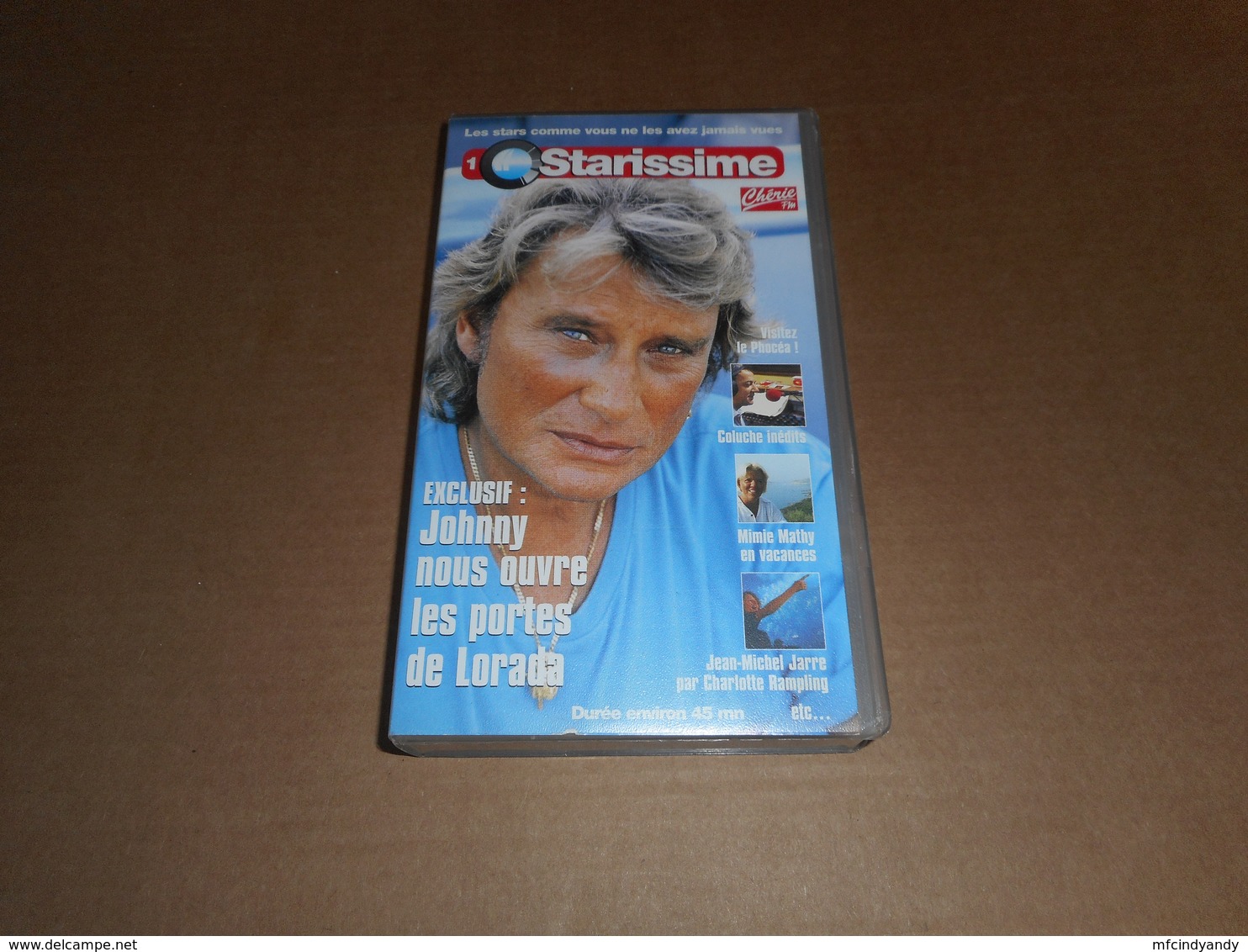 Cassette VHS - Johnny Hallyday -  Starissime - Avec Coluche, Mimie Mathy, Jean Michel Jarre ... - Konzerte & Musik