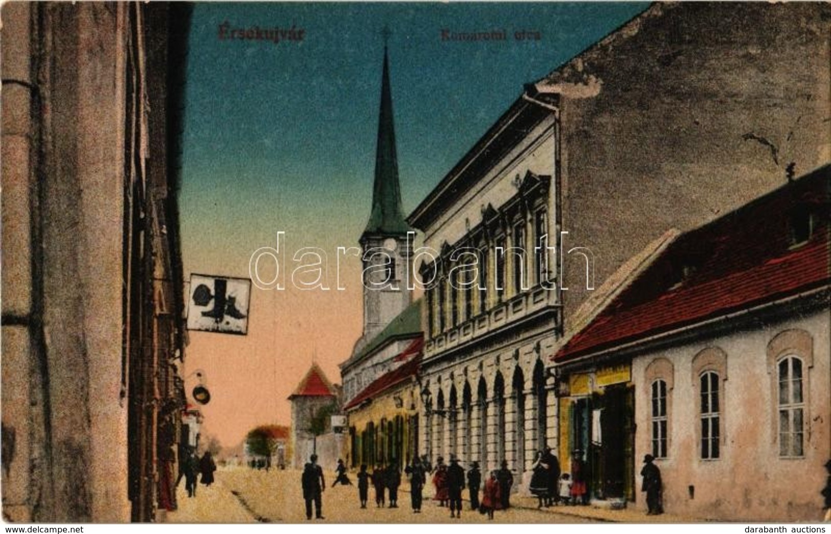 ** T1 Érsekújvár, Nové Zamky; Komáromi Utca, üzletek. Vasúti Levelezőlapárusítás 22. Sz. 1918 / Street, Shop - Non Classés