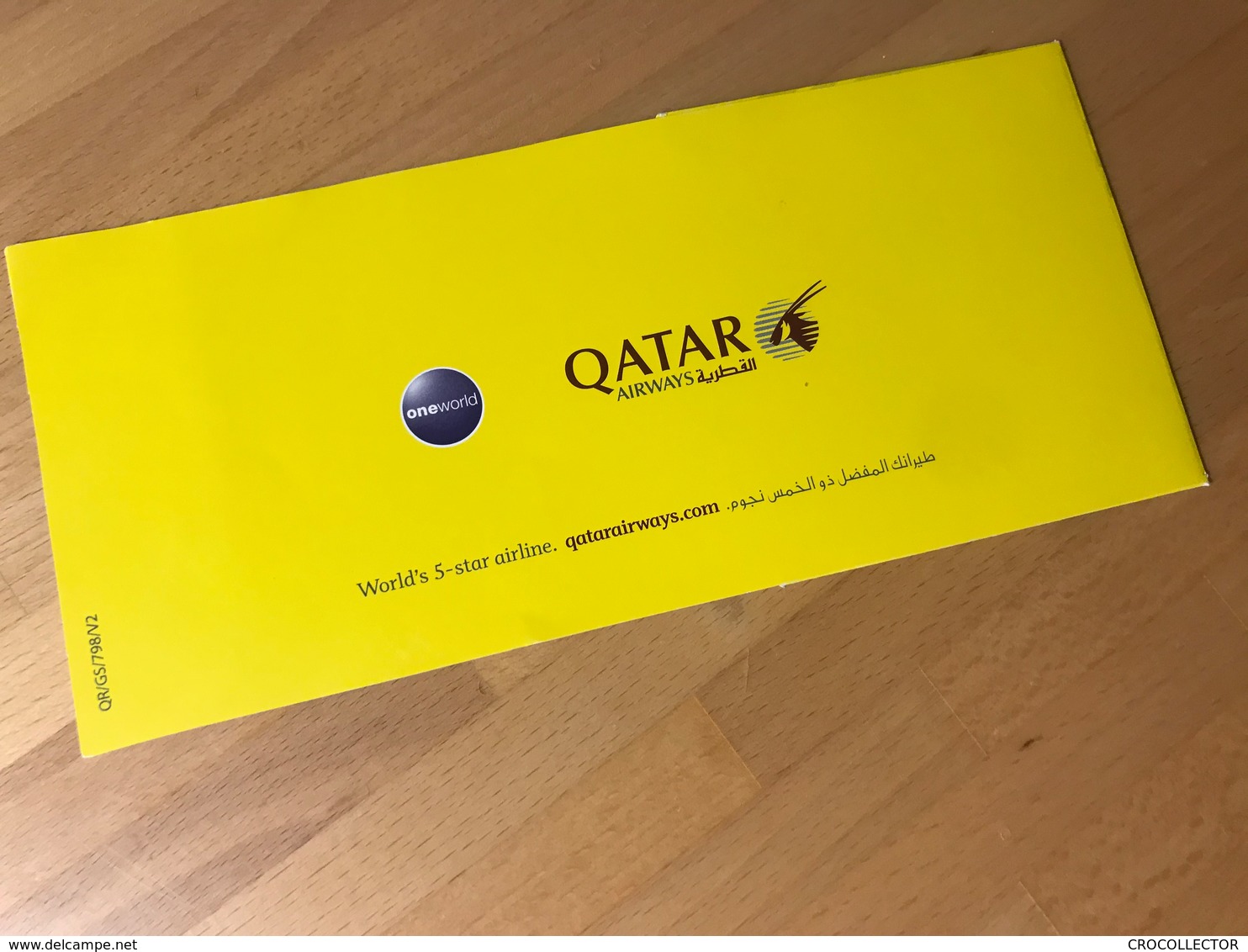 QATAR AIRWAYS ONE WORLD ECONOMY CLASS BOARDING PASS YELLOW JACKET AT HAMAD INTERNATIONAL AIRPORT DOHA - Stationery