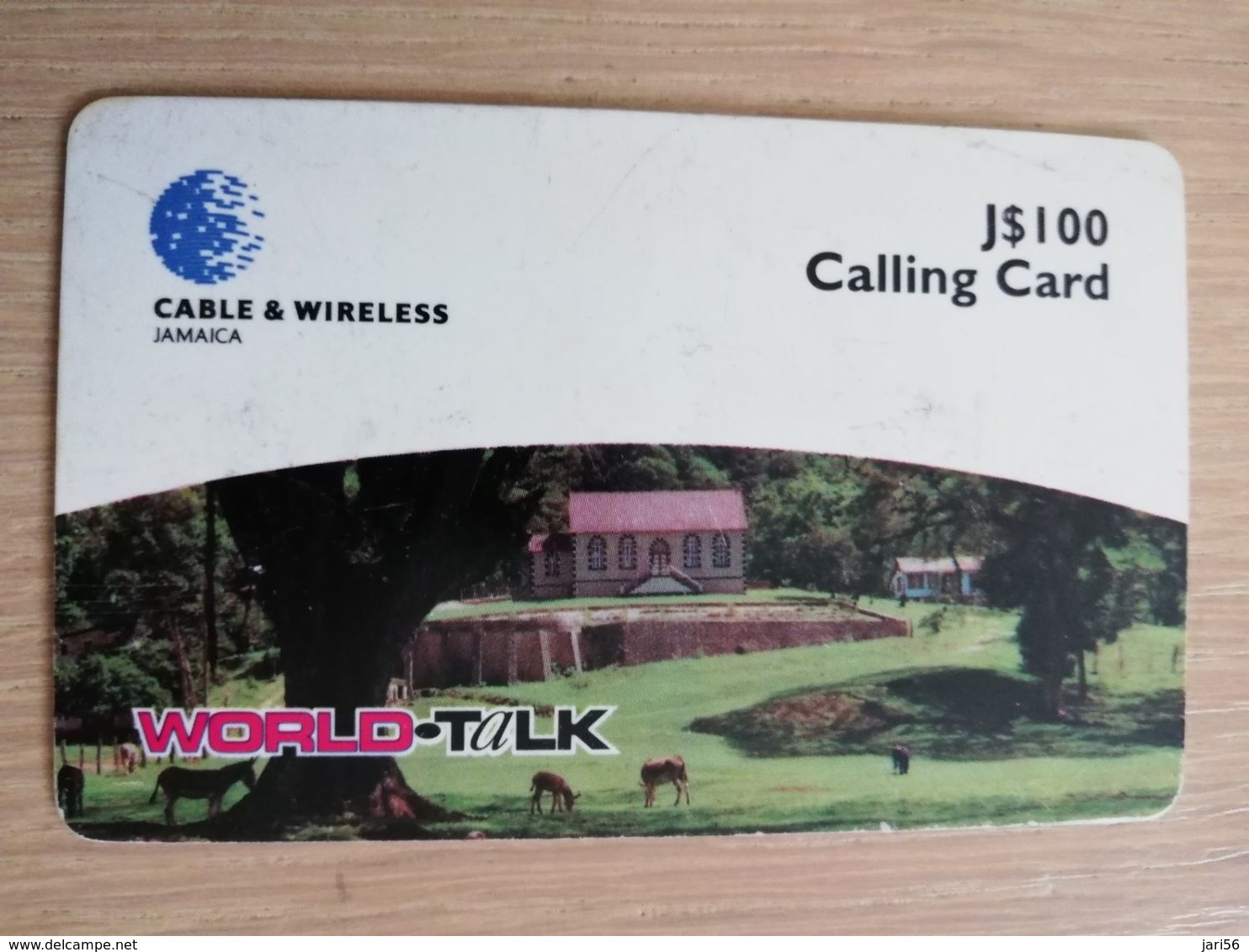 JAMAICA  J$100,-  PREPAID World -talk  THICK CARD Cable&wireless  P83  Fine Used Card  **2214** - Giamaica