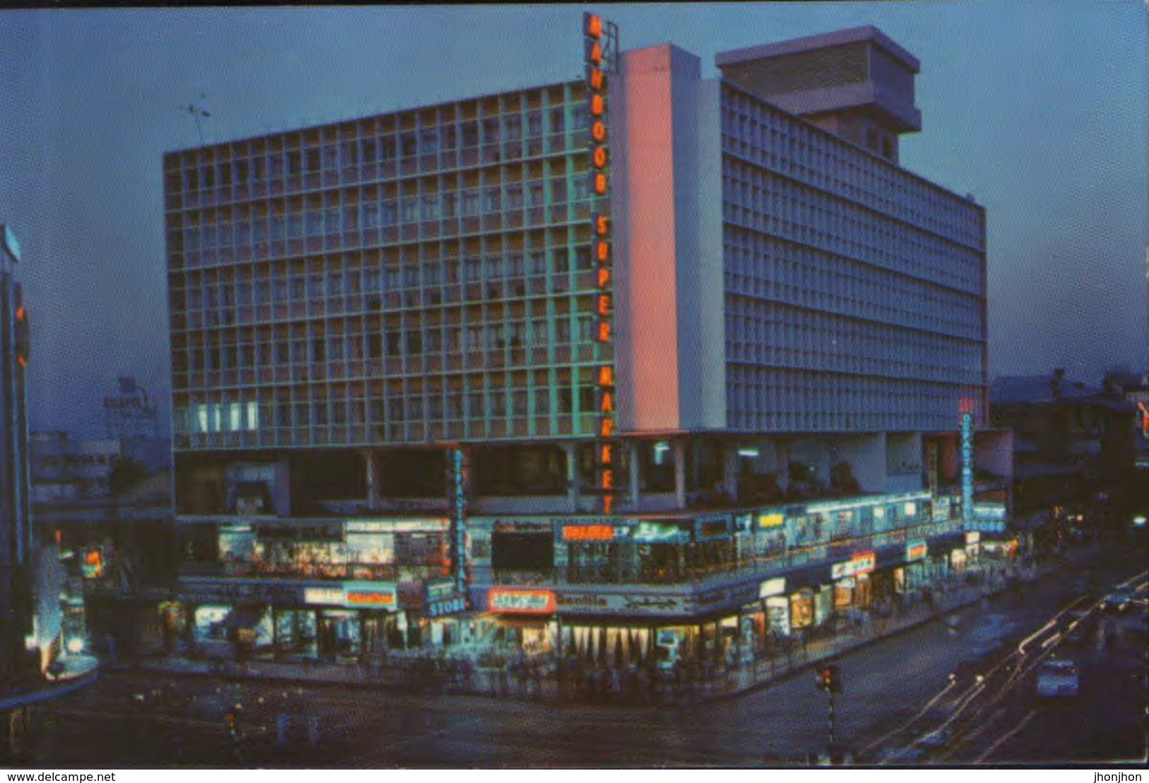 Pakistan -   Postcard Unused  - Night Scene Of A Glittering Shopping Centre At Sadar- The Hub Of Karachi - Pakistan