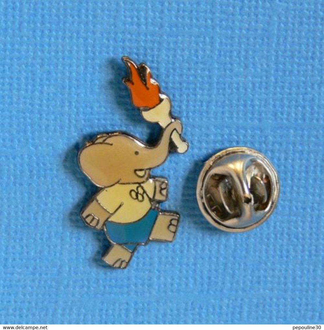 1 PIN'S //  ** BABAR / PORTEUR DE LA FLAMME OLYMPIQUE ** . (Babar Characters TM ©1991Lde Brunhoff Ferrier Toulouse) - BD