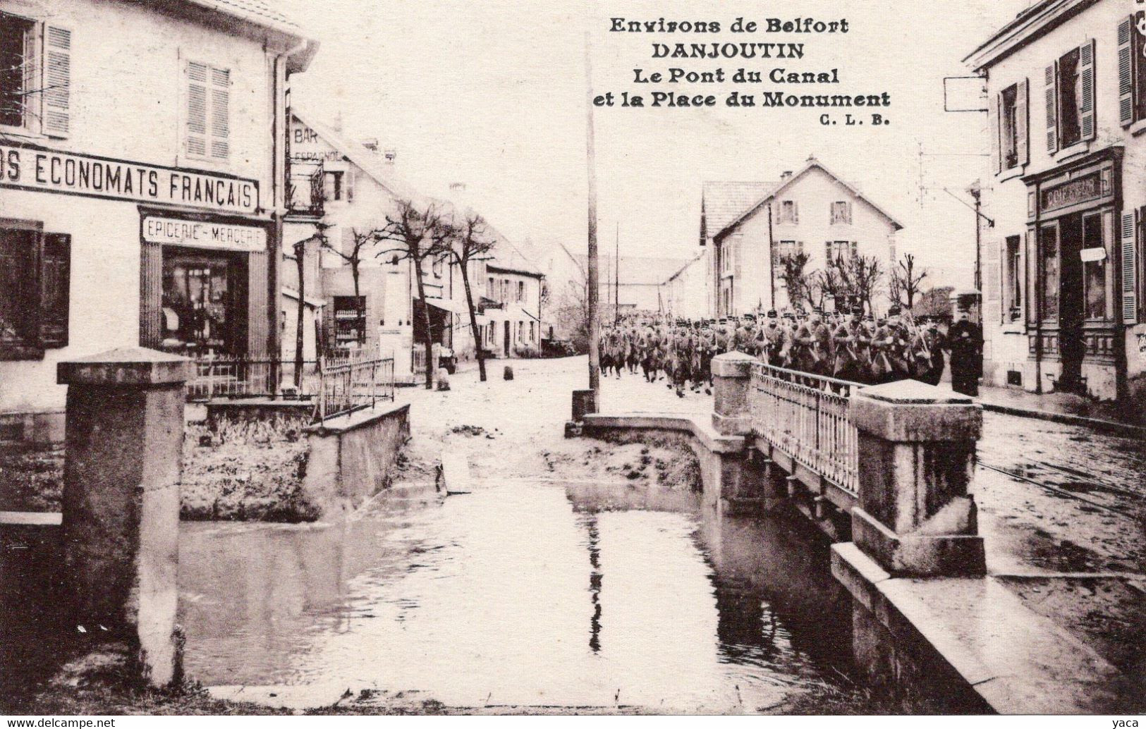 Danjoutin Le Pont Du Canal Et La Place Du Monument  Défilé Militaire   économats Français - Danjoutin