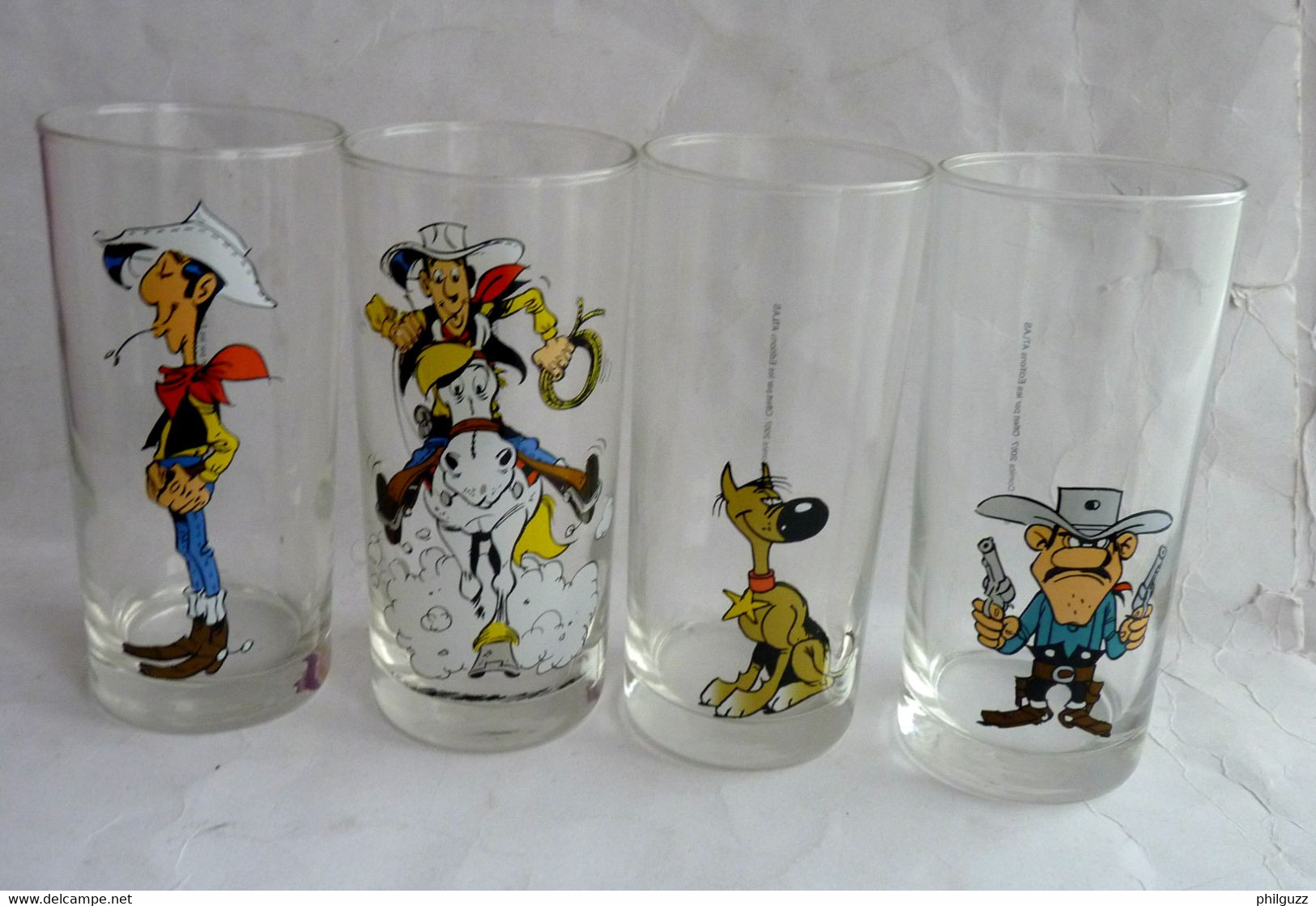 SERIE COMPLETE DE 4 VERRES LUCKY LUKE PUBLICITAIRES ATLAS 2004 - Verre - Arte Della Tavola