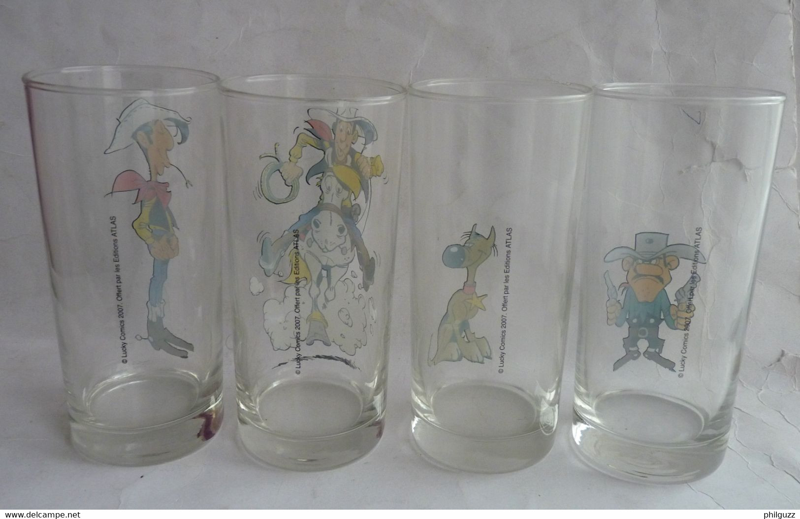 SERIE COMPLETE DE 4 VERRES LUCKY LUKE PUBLICITAIRES ATLAS 2004 - Verre - Arte Della Tavola