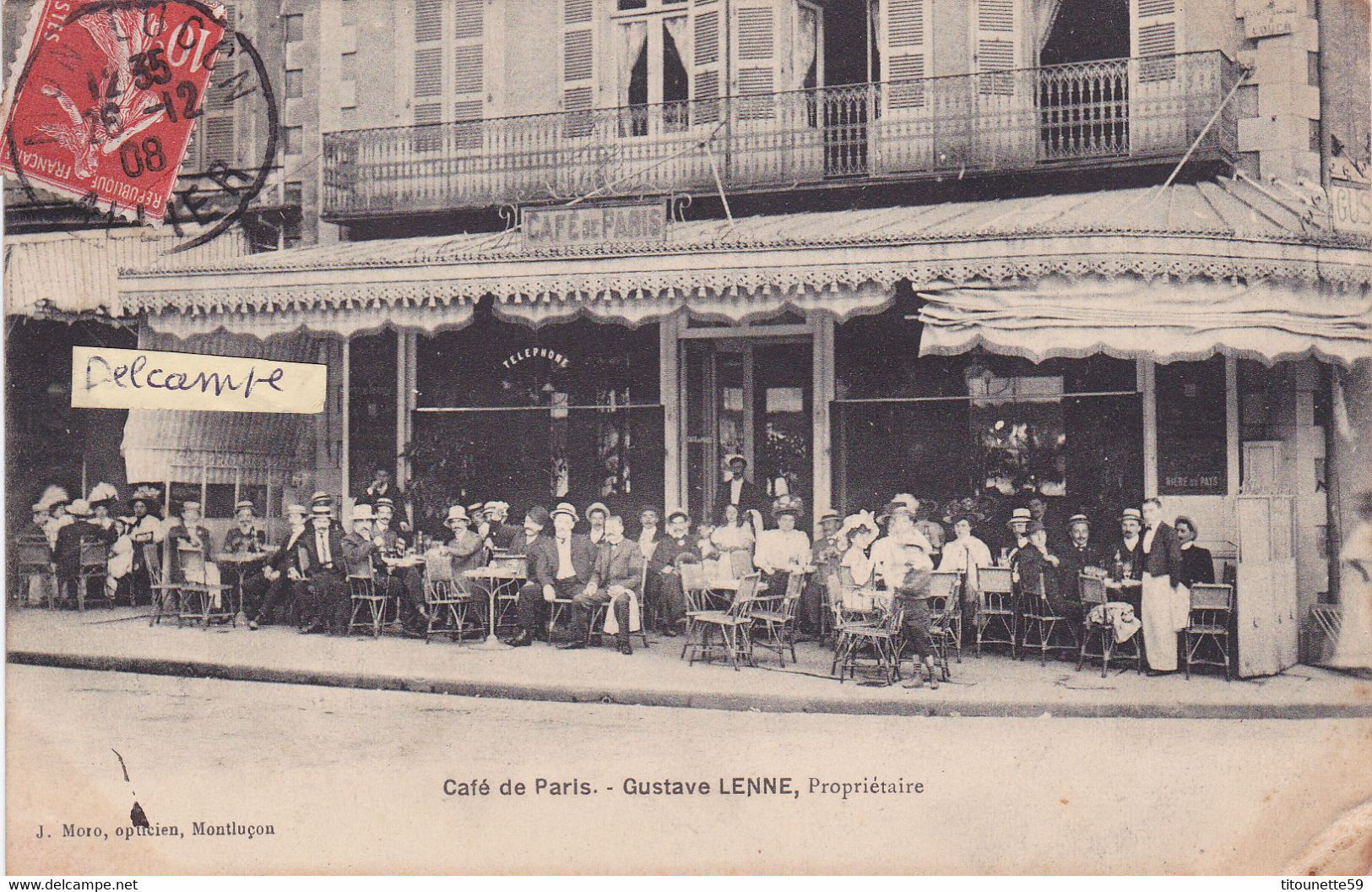 03-MONTLUCON- "CAFE De PARIS- GUSTAVE LENNE, PROPRIETAIRE-TERRASSE ANIMEE-Ecrite Le 26/12/1908-Edit. J. MORO OPTICIEN - Cafés