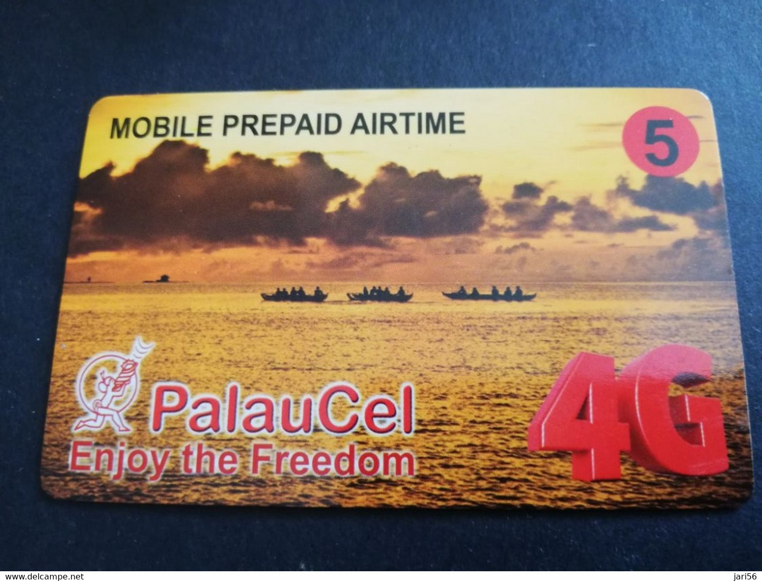 PALAU $5 PNCC  PALAUCEL  ENJOY THE FREEDOM  4G/  KANOES ON OCEAN   PREPAID AIRTIME   DEBUSCH     ** 5650 ** - Palau