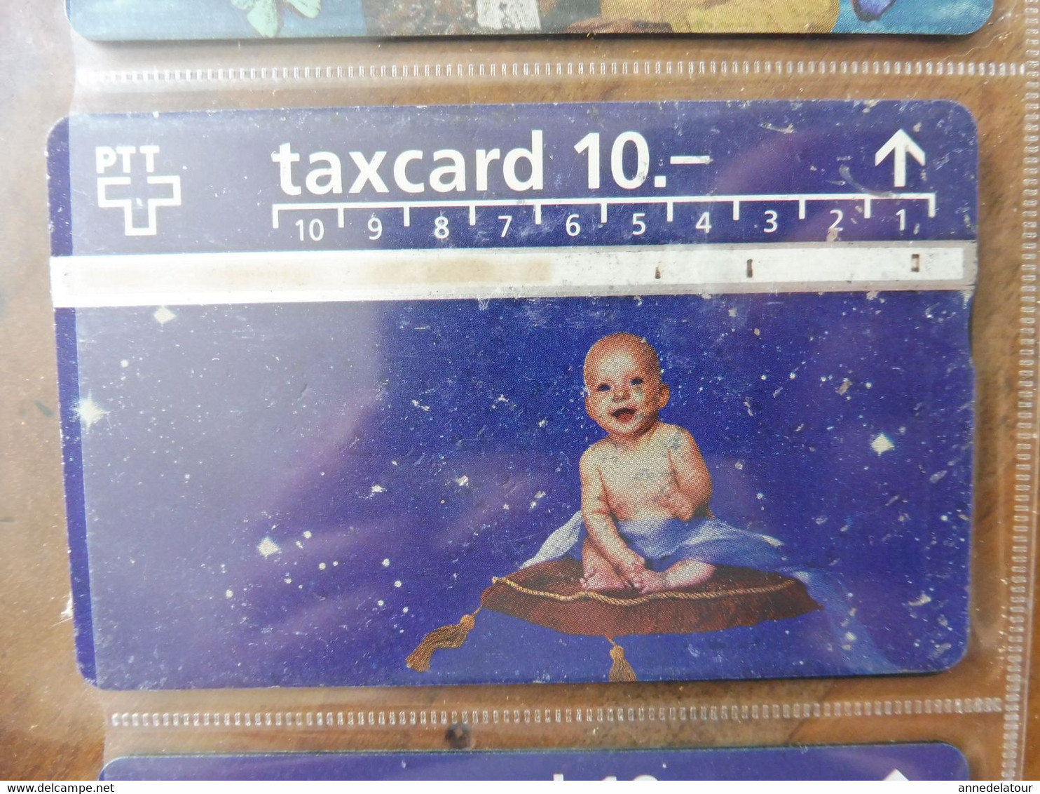 10  télécartes  TAXCARD  illustrées  (personnages divers ) origine SUISSE