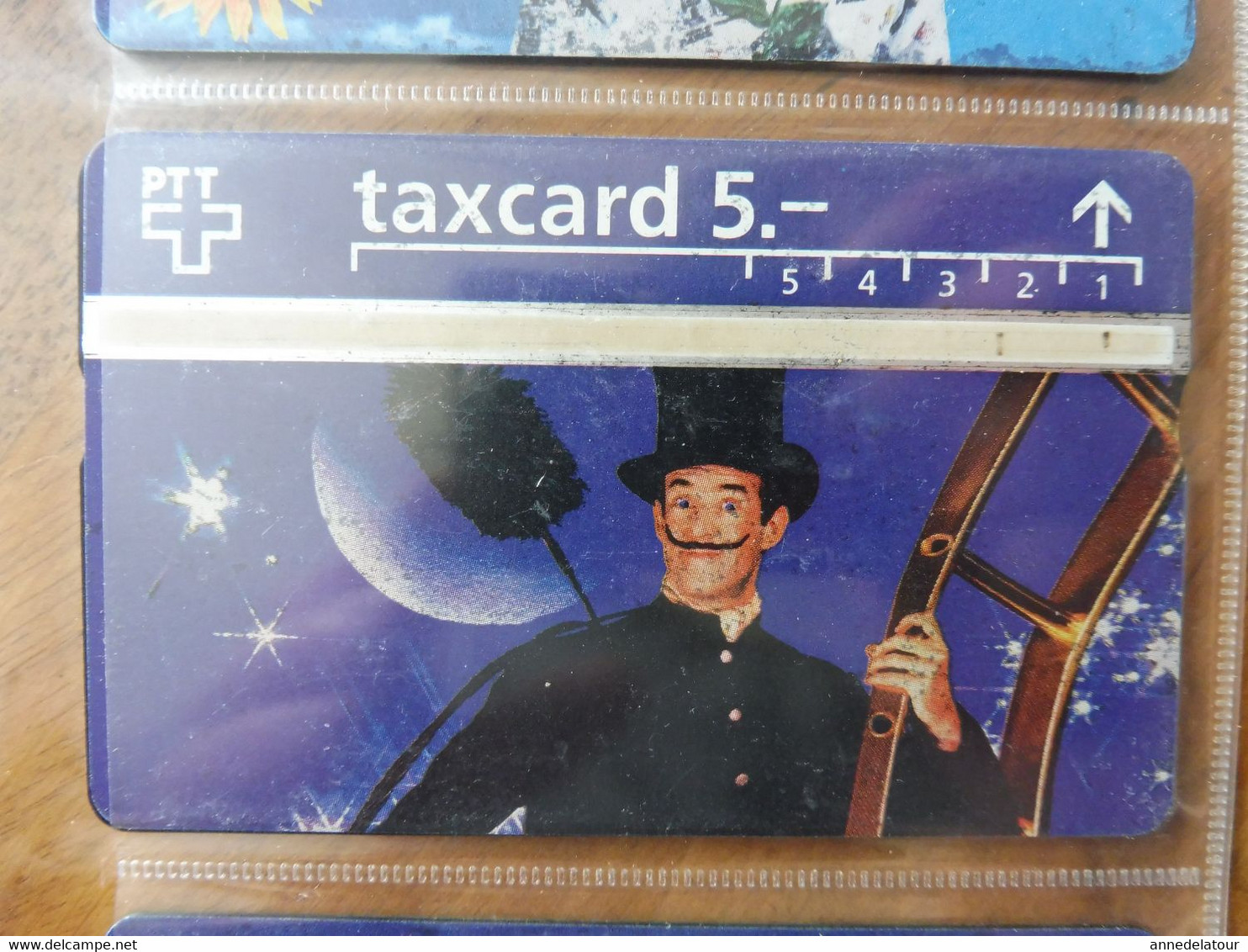 10  télécartes  TAXCARD  illustrées  (personnages divers ) origine SUISSE