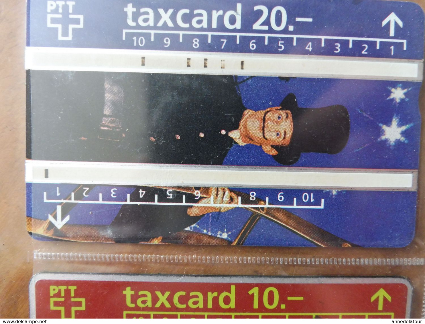 10  télécartes  TAXCARD  illustrées  (personnages divers ) origine SUISSE